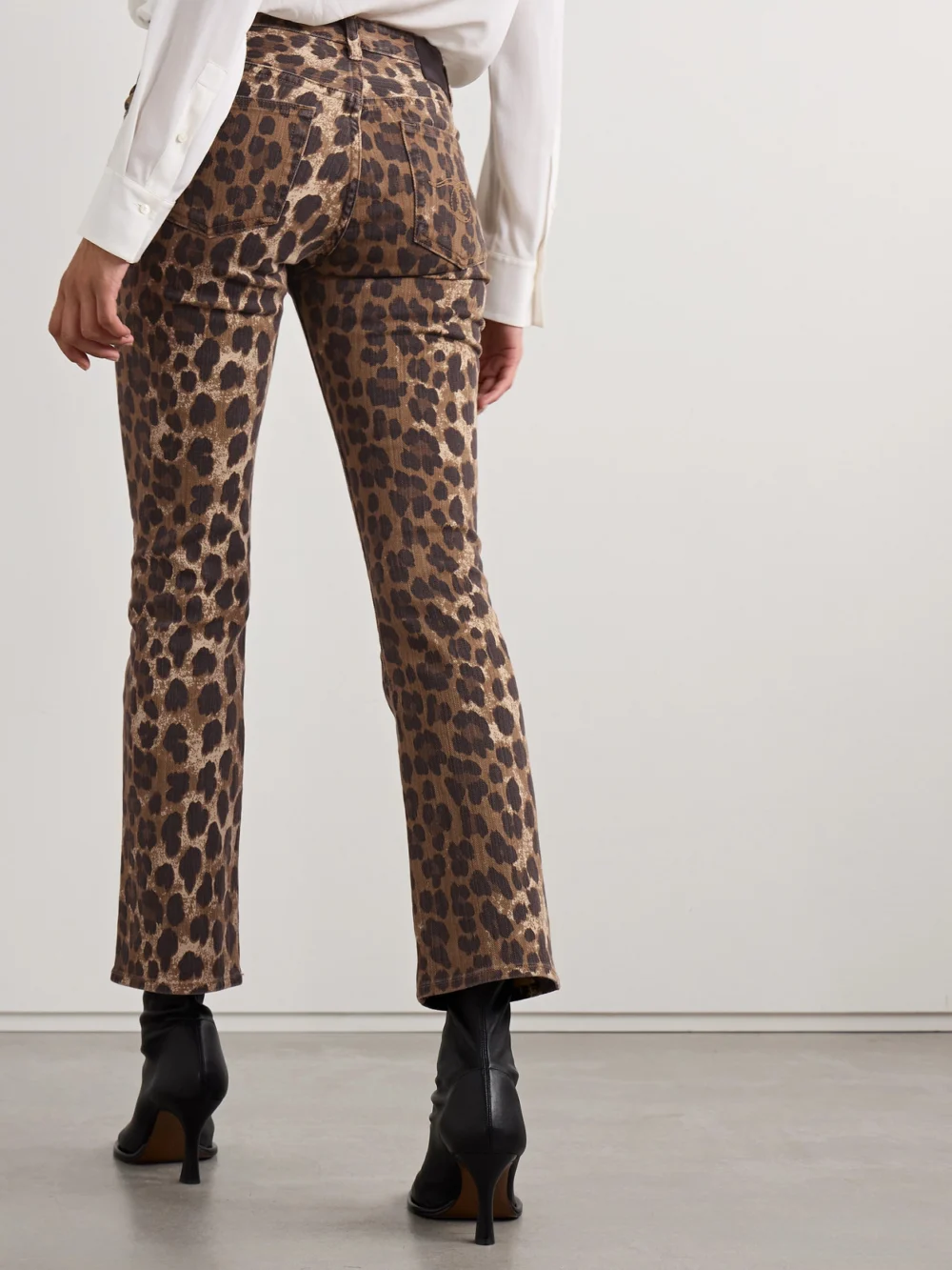 Back view of the R13 Kick Fit Cropped Leopard-print Mid-rise Flared Jeans