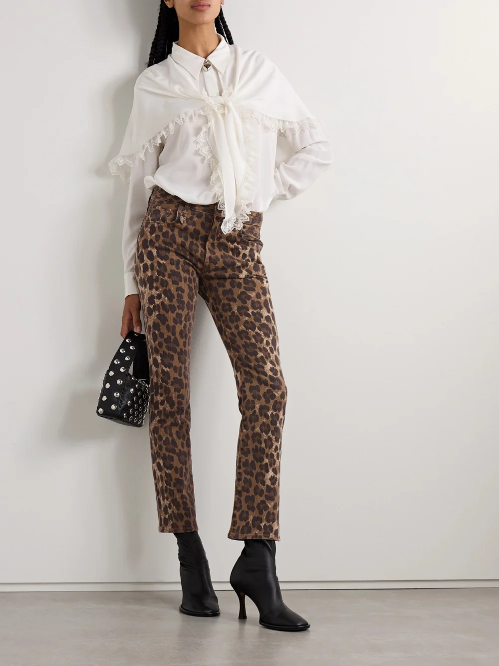 R13 Kick Fit Cropped Leopard-print Mid-rise Flared Jeans, worn by a model