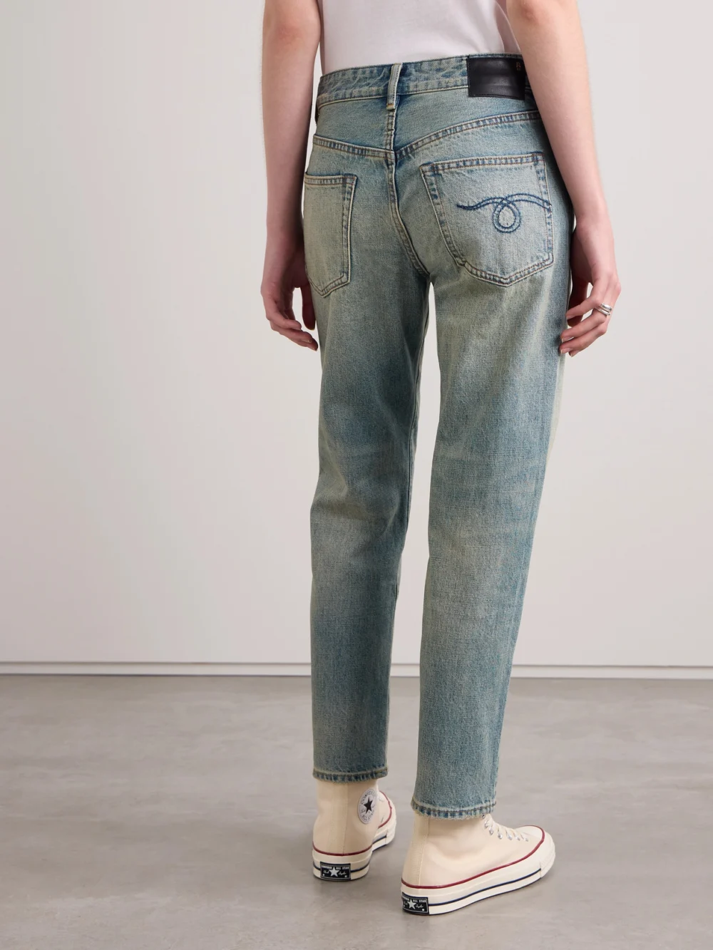 Back view of the R13 Romeo Jean Slim Boyfriend Distressed Low-rise Straight-leg Jeans