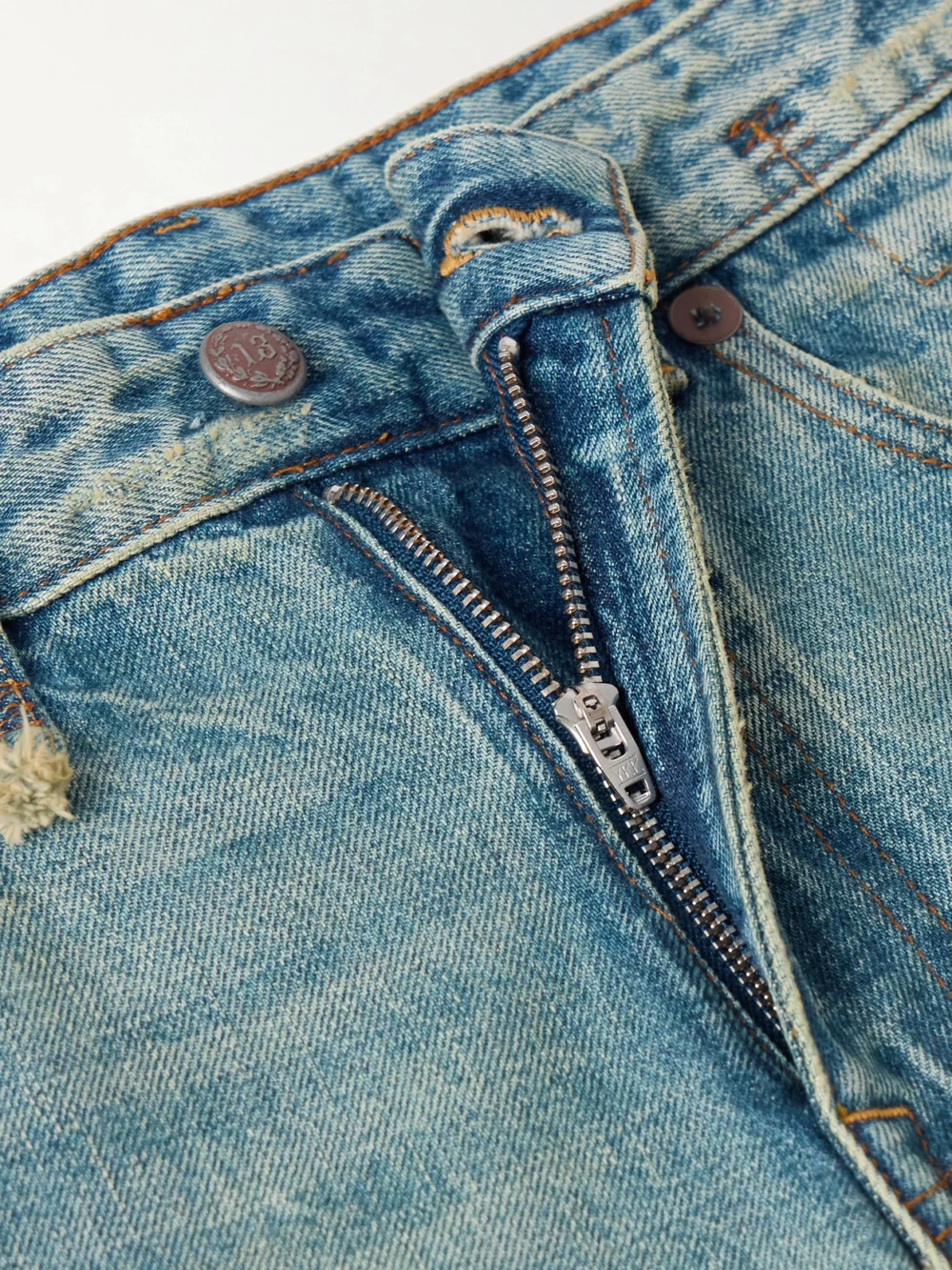 Close-up detail of the R13 Romeo Jean Slim Boyfriend Distressed Low-rise Straight-leg Jeans