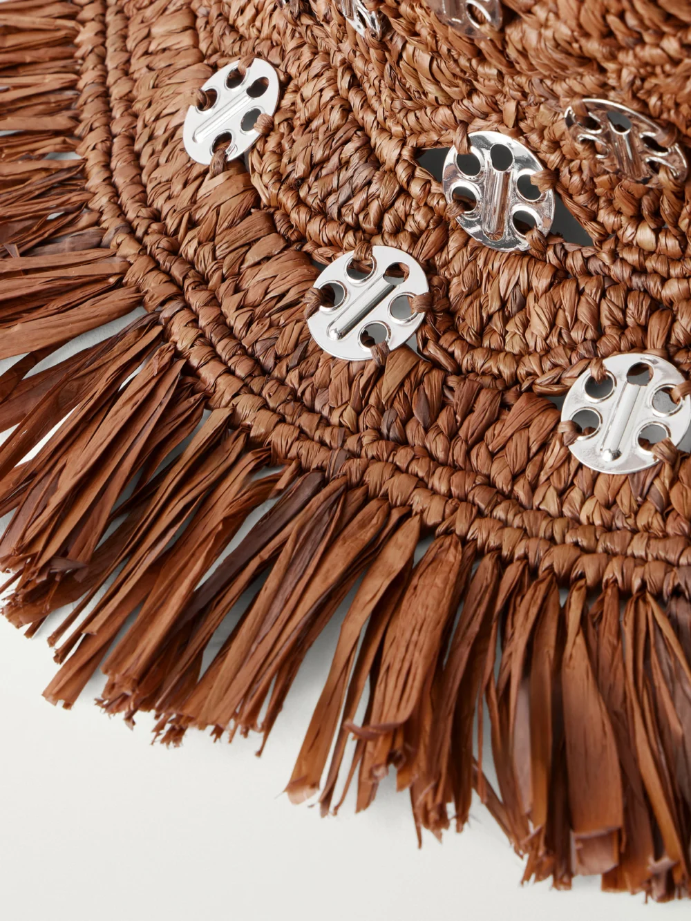 Close-up detail of the Rabanne Autres Embellished Fringed Raffia Hat