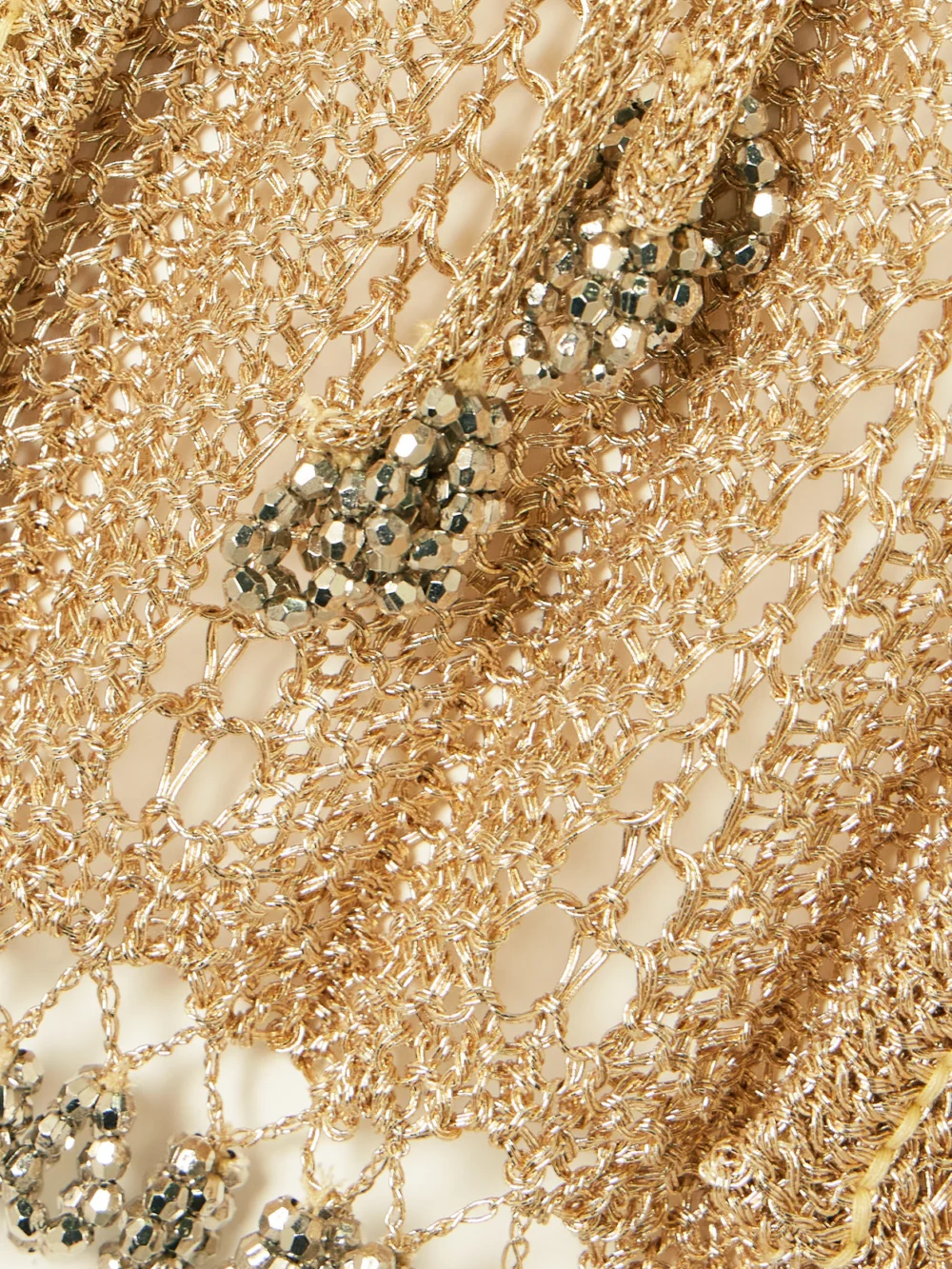 Close-up detail of the Rabanne Bead-embellished Metallic Open-knit Cardigan