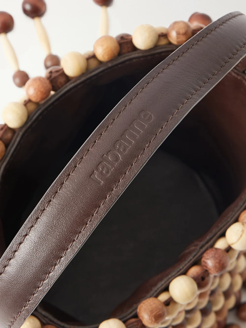 Close-up detail of the Rabanne Beaded Mini Wood Shoulder Bag