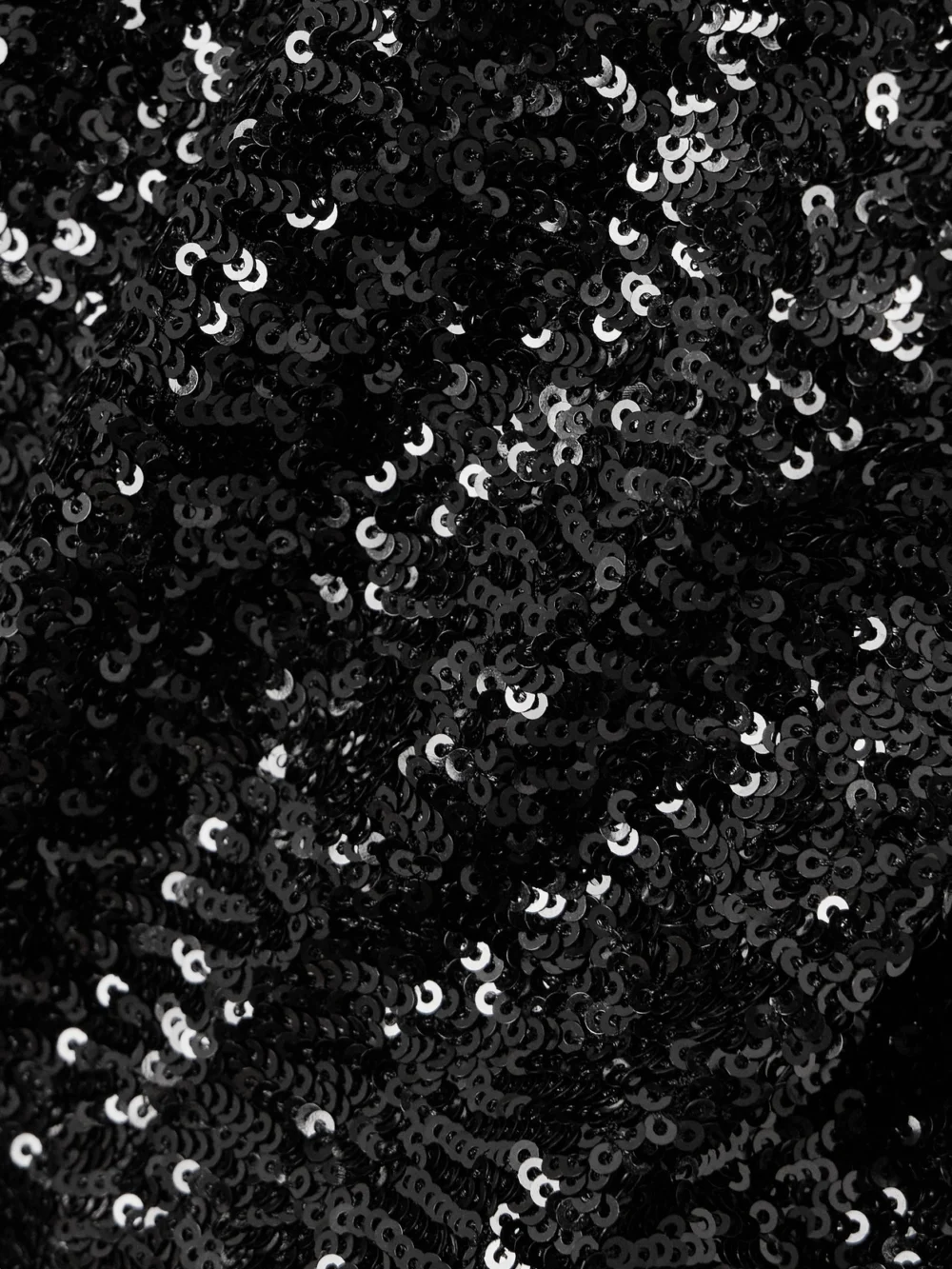 Close-up detail of the Rabanne Bow-embellished Sequined Ruffled Woven Mini Dress