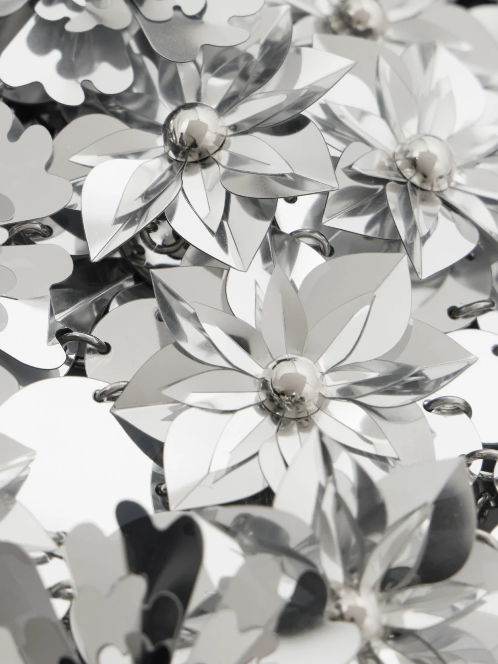 Close-up detail of the Rabanne Cropped Embellished Chainmail Top