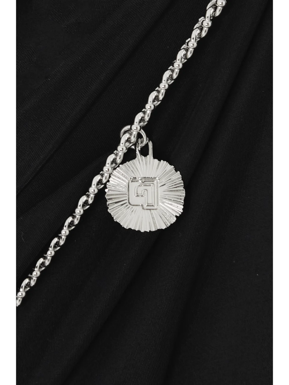 Close-up detail of the Rabanne Embellished Cutout Stretch-jersey Maxi Dress