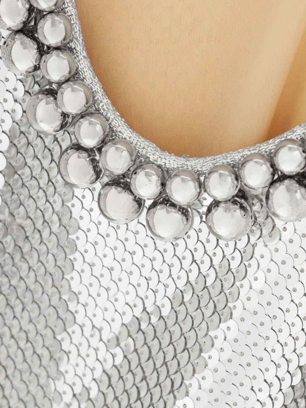 Close-up detail of the Rabanne Embellished Sequined Mesh Mini Dress