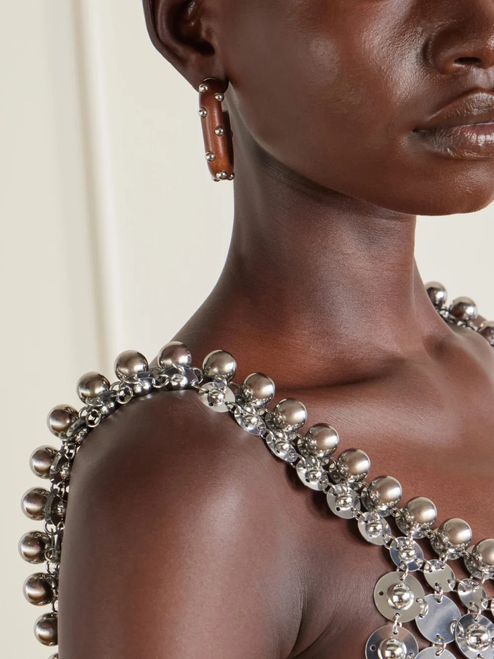 Close-up detail of the Rabanne Embellished Silver-tone Earrings