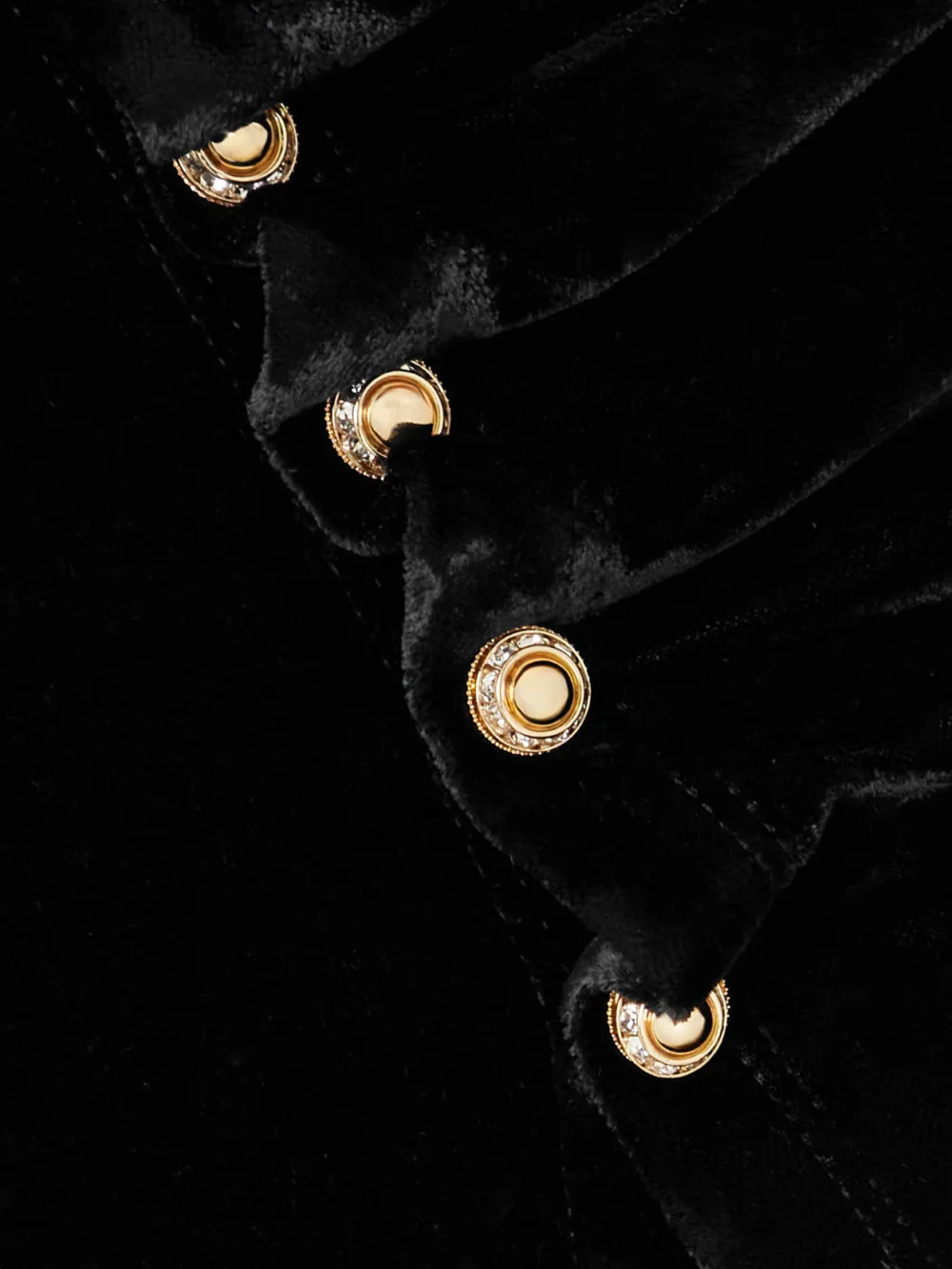 Close-up detail of the Rabanne Embellished Velvet Turtleneck Top