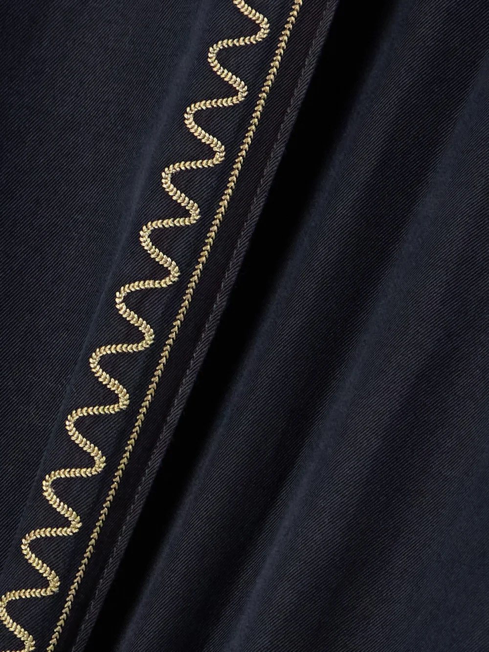 Close-up detail of the Rabanne Embroidered Belted Layered Twill Pants