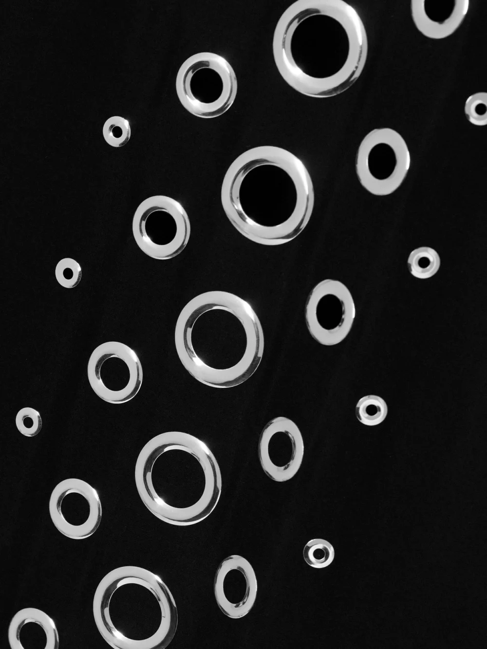 Close-up detail of the Rabanne Eyelet-embellished Stretch-jersey Maxi Dress