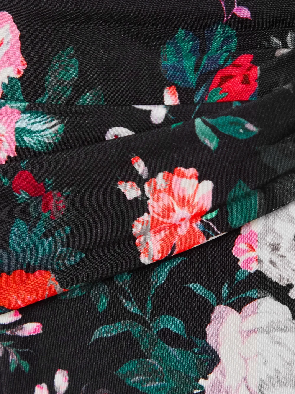 Close-up detail of the Rabanne Floral-print Stretch-jersey Flared Pants