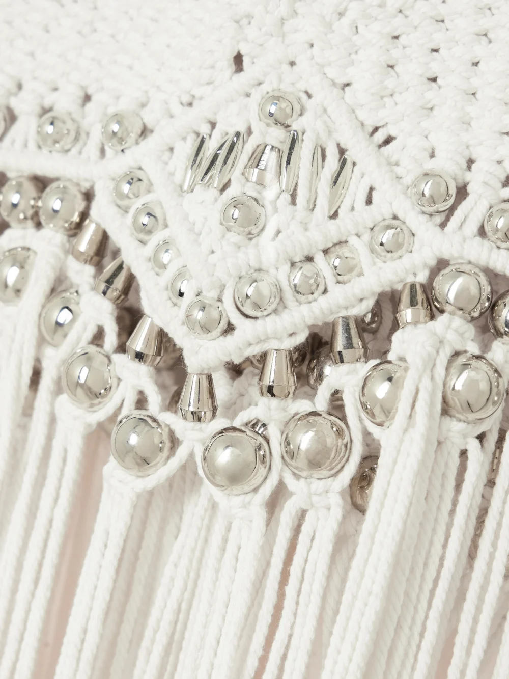 Close-up detail of the Rabanne Fringed Embellished Macramé Halterneck Top