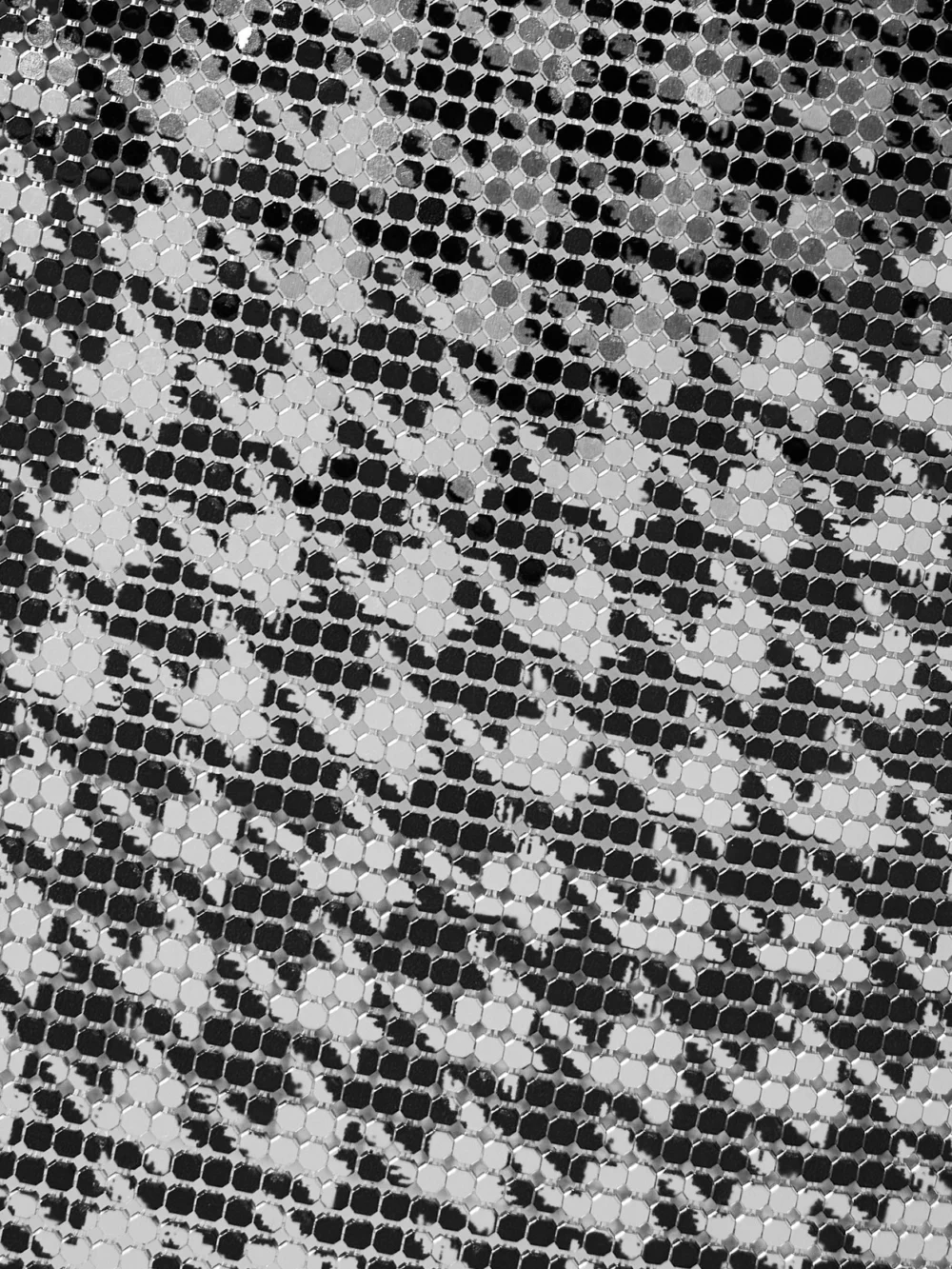Close-up detail of the Rabanne Houndstooth Chainmail Mini Dress