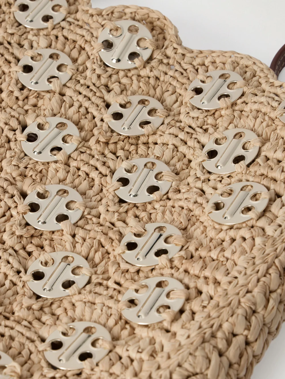 Close-up detail of the Rabanne Leather-trimmed Embellished Woven Raffia Shoulder Bag