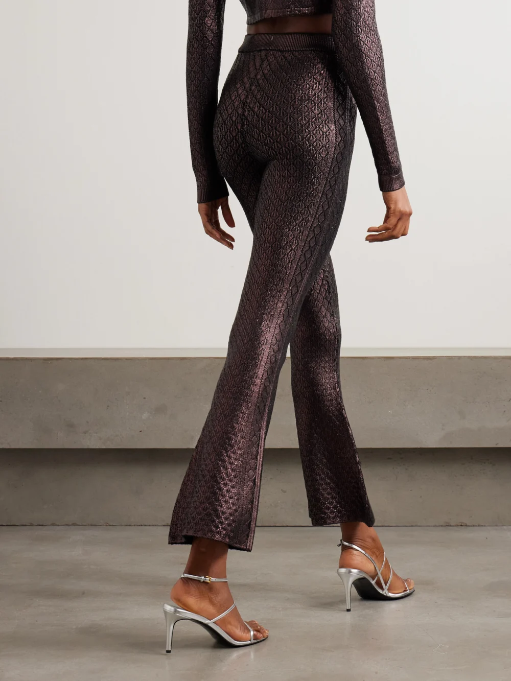 Back view of the Rabanne Metallic Jacquard-knit Flared Pants