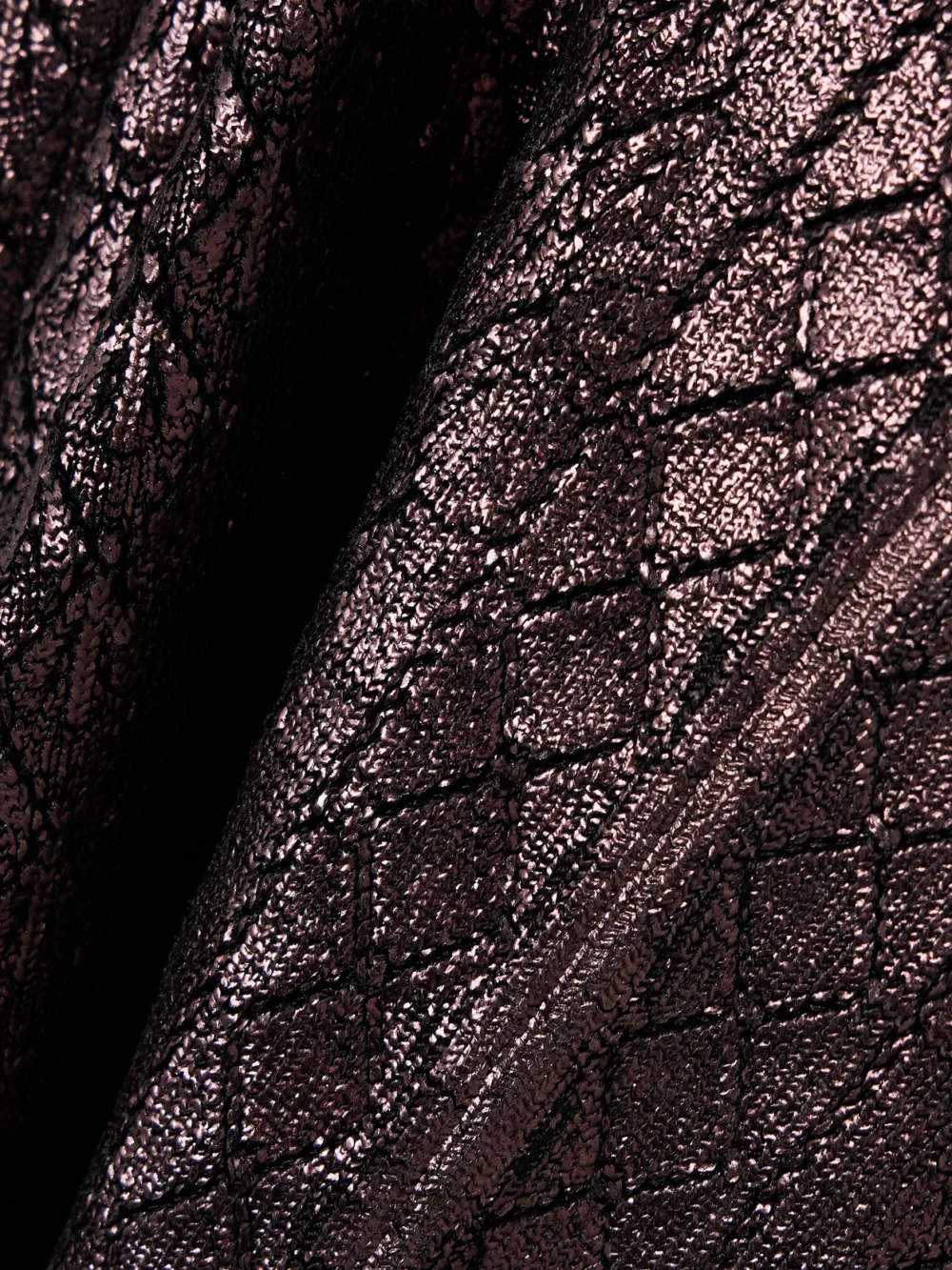 Close-up detail of the Rabanne Metallic Jacquard-knit Flared Pants