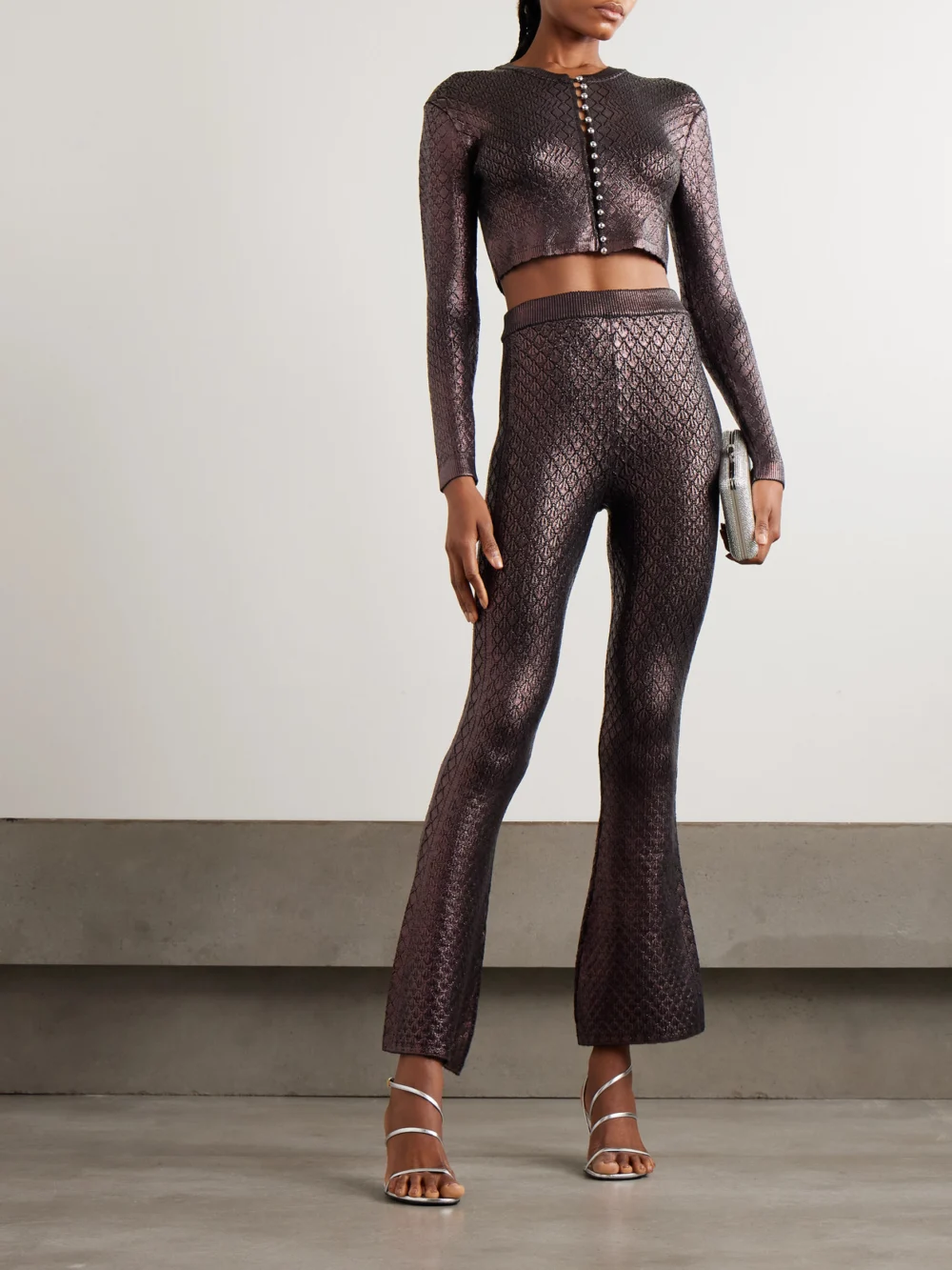 Rabanne Metallic Jacquard-knit Flared Pants, worn by a model