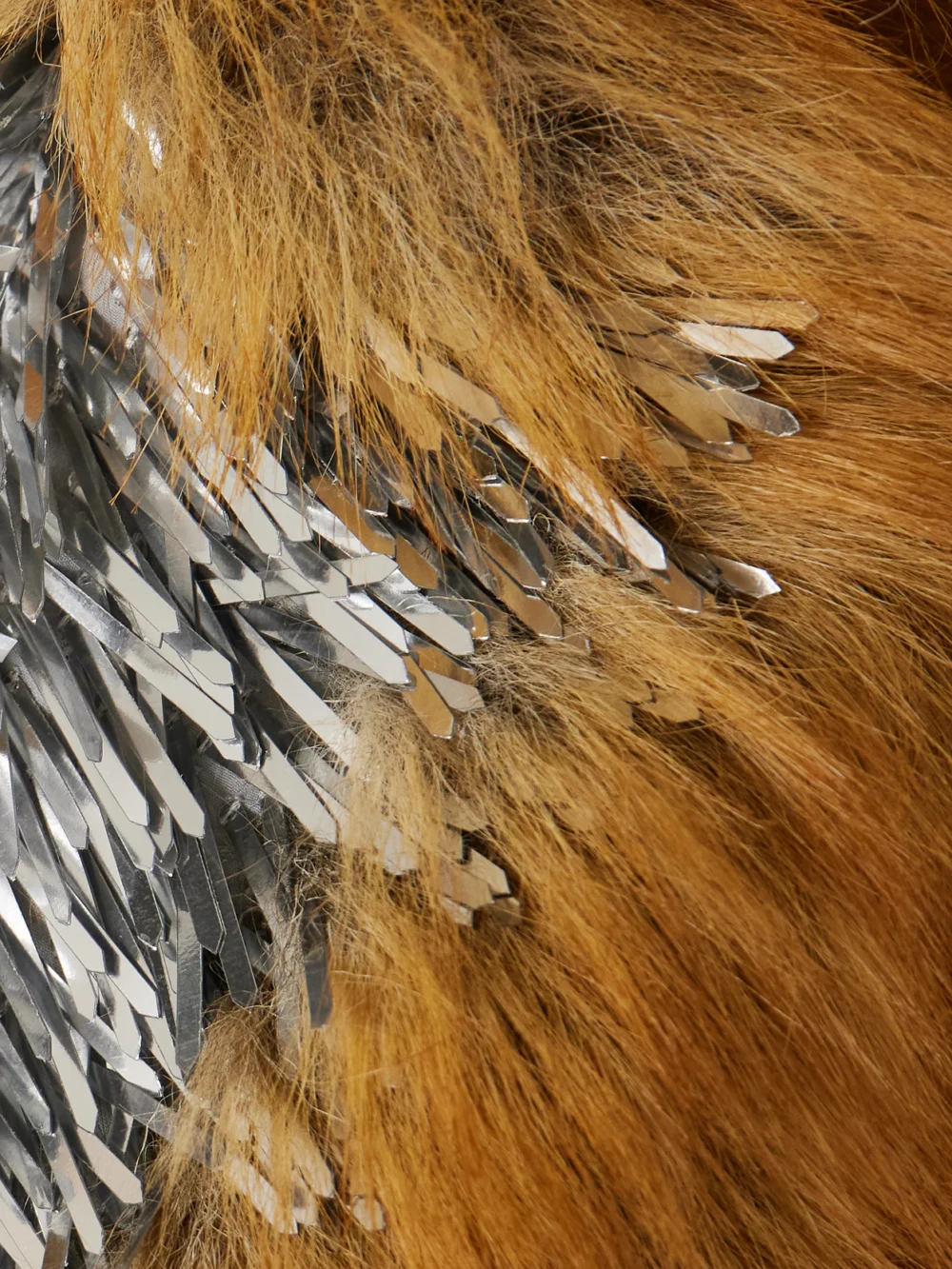 Close-up detail of the Rabanne Oversized Embellished Plush Coat