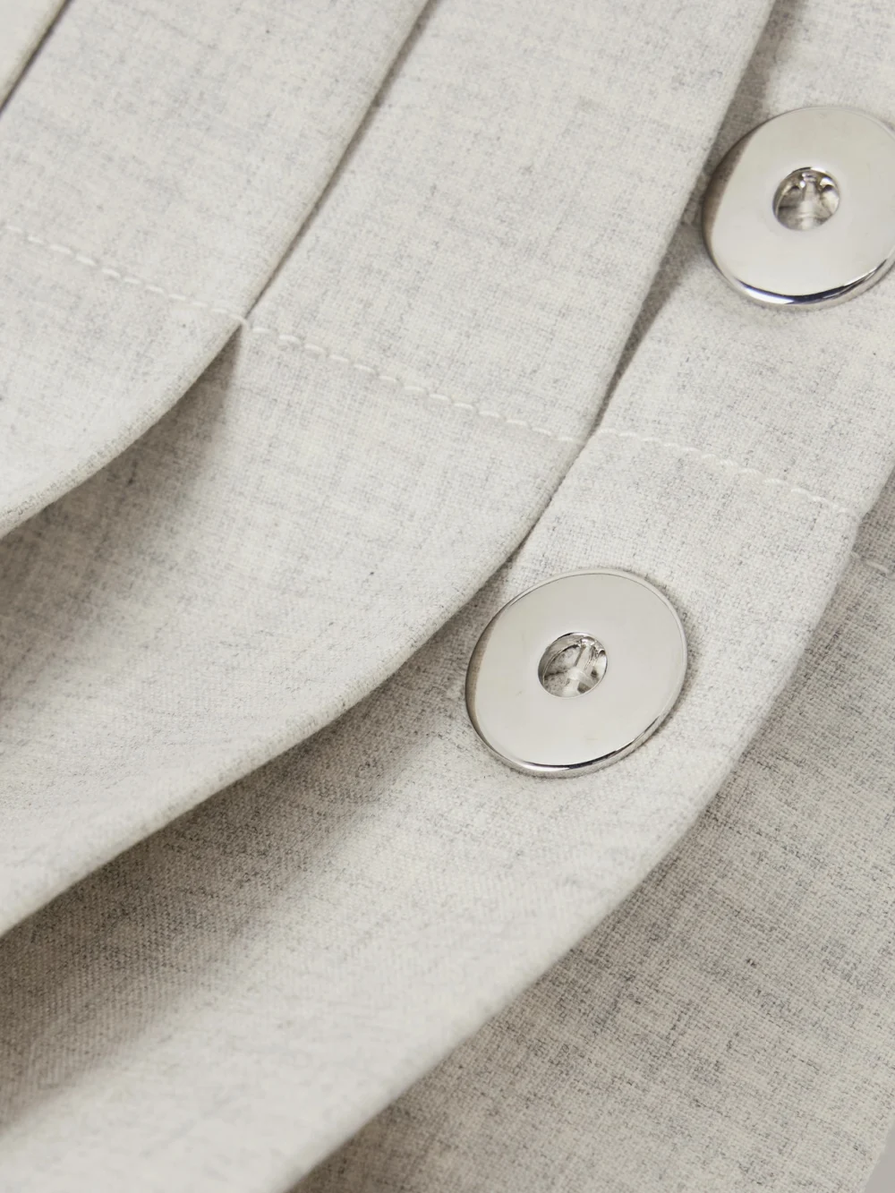 Close-up detail of the Rabanne Pleated Cotton and Linen-blend Mini Skirt