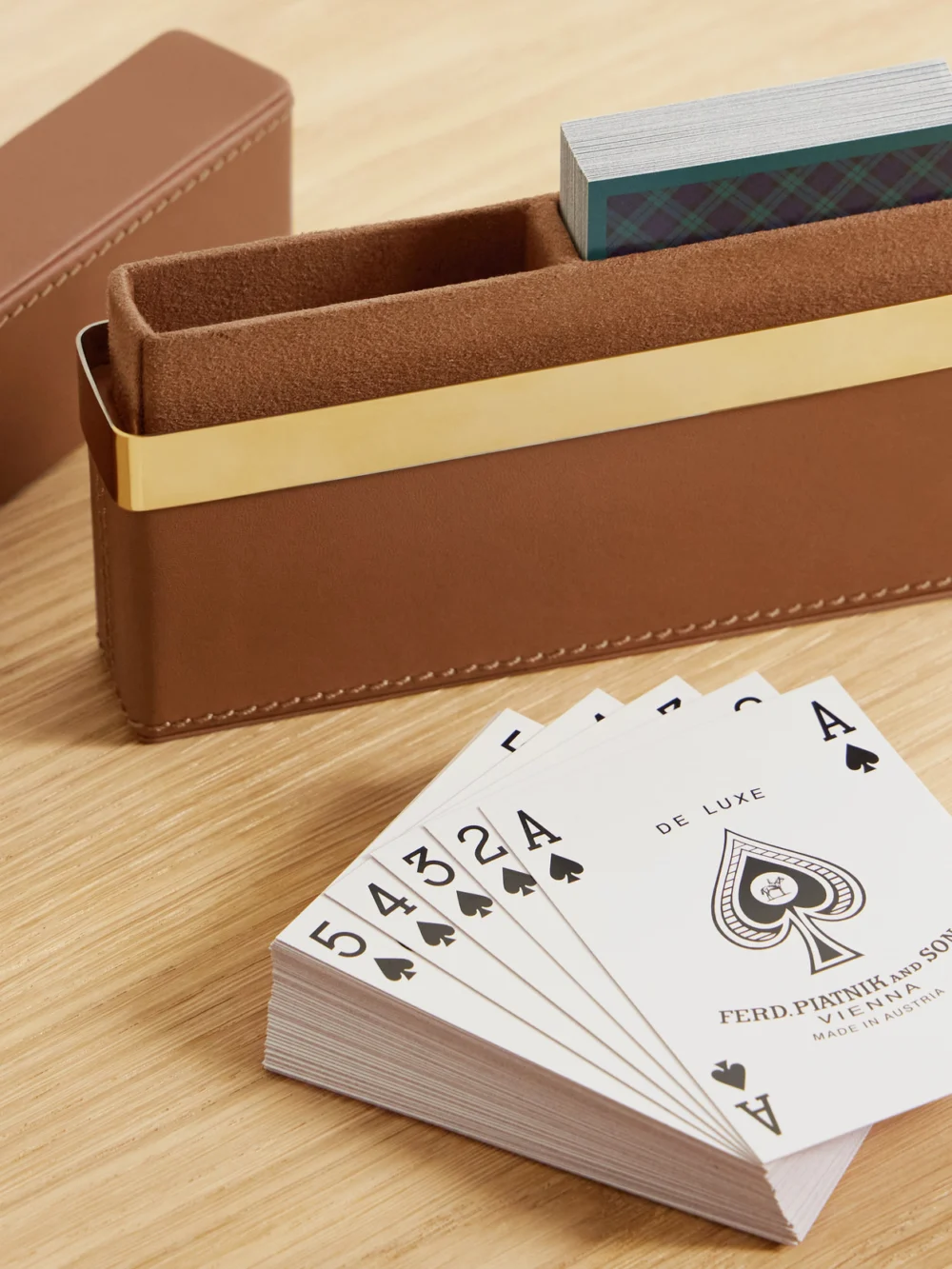 Close-up detail of the Ralph Lauren Home Westover Leather and Gold-tone Playing Cards Set