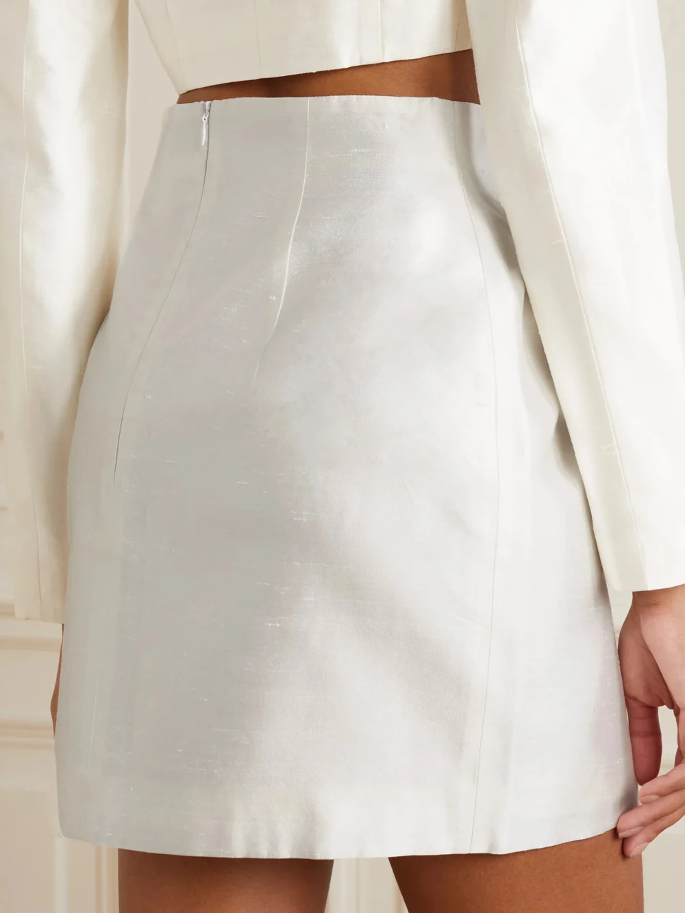 Back view of the Rasario Ruched Button-embellished Silk Mini Skirt