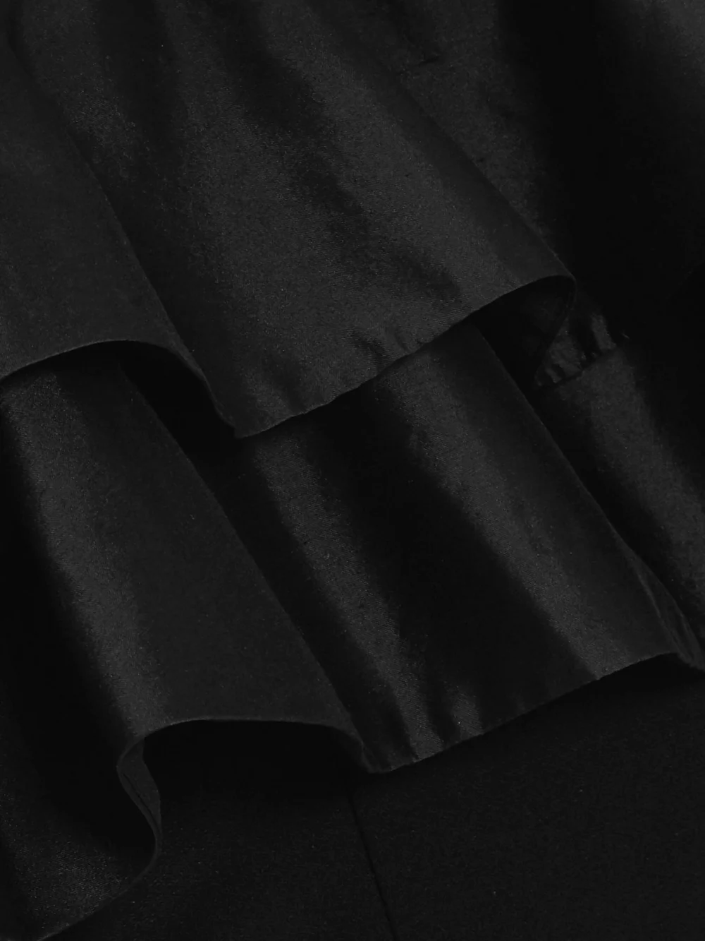 Close-up detail of the Rasario Ruffled Silk and Crepe Gown