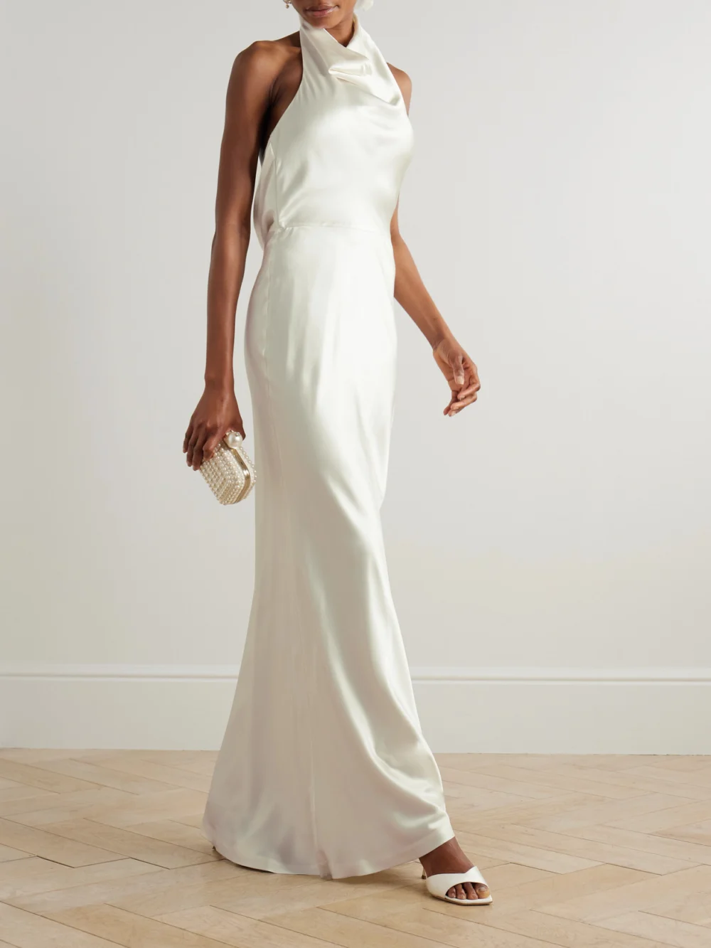 Rebecca Vallance Attia Draped Silk-satin Halterneck Gown, worn by a model