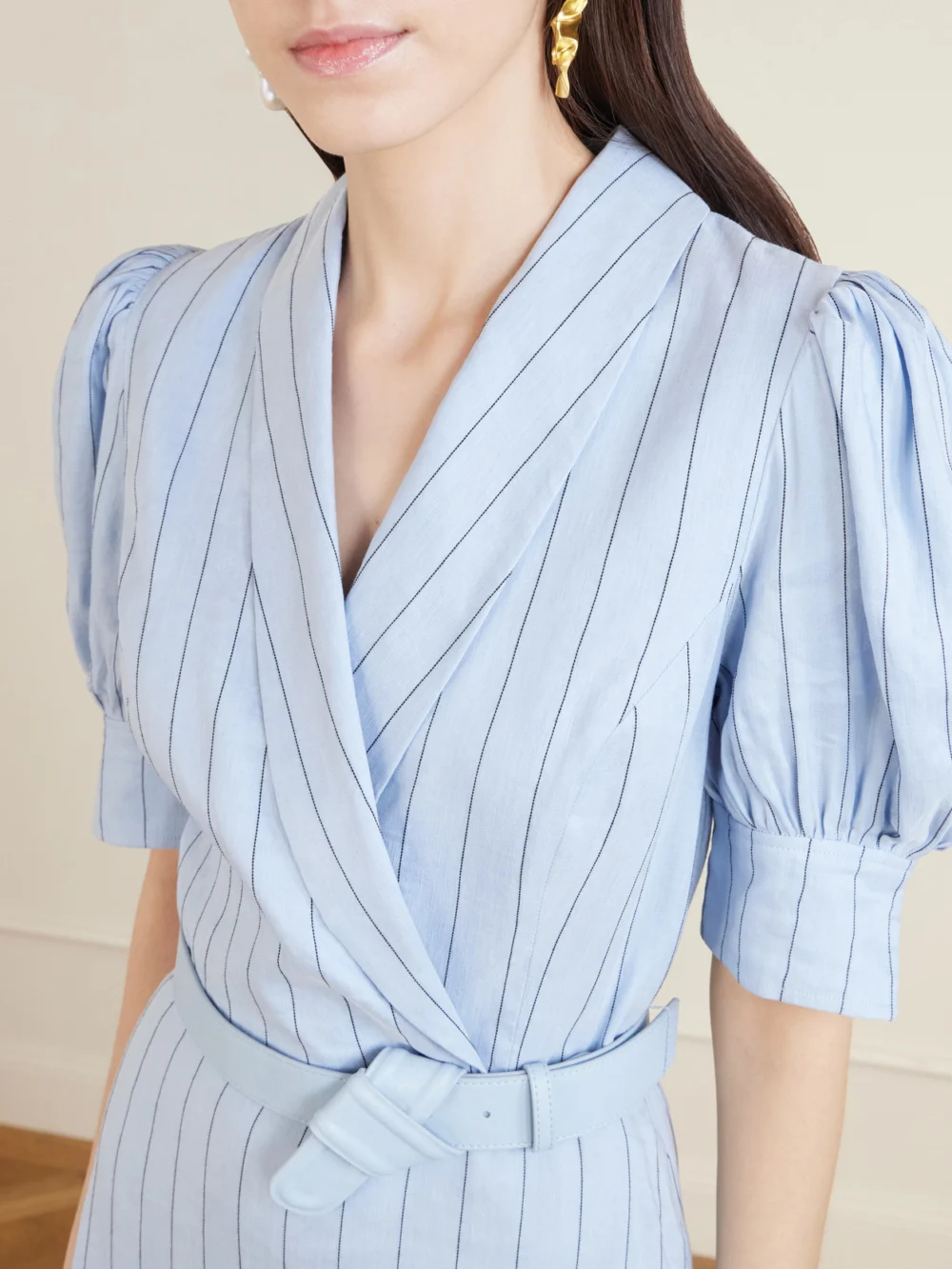 Close-up detail of the Rebecca Vallance Effie Belted Striped Linen-blend Midi Dress