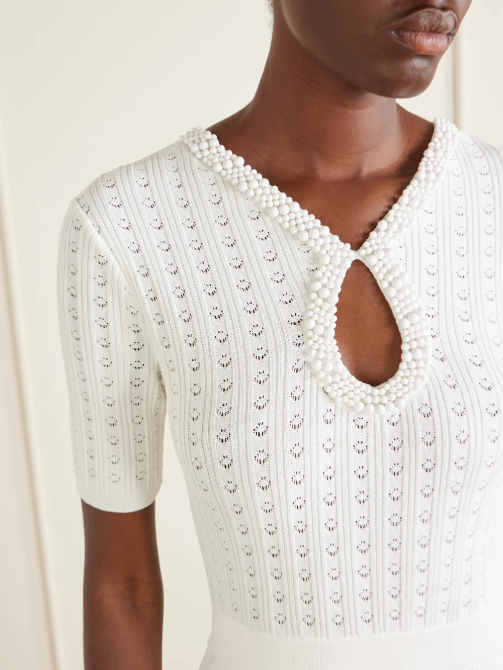 Close-up detail of the Rebecca Vallance Embellished Crochet-knit Midi Dress