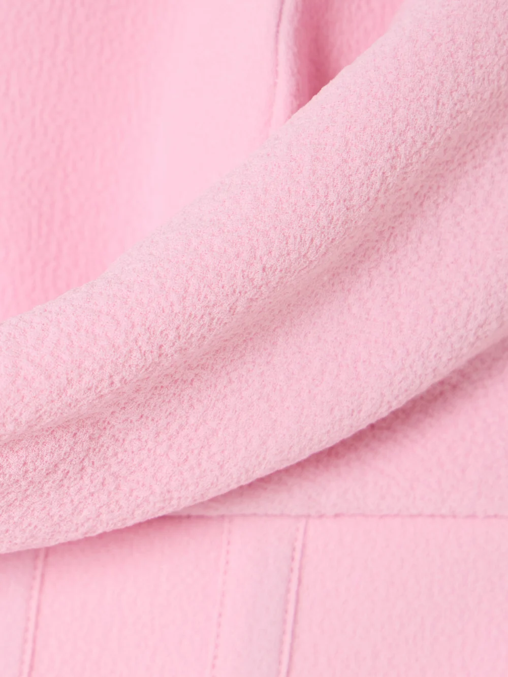Close-up detail of the Rebecca Vallance Empress Strapless Draped Crepe Mini Dress
