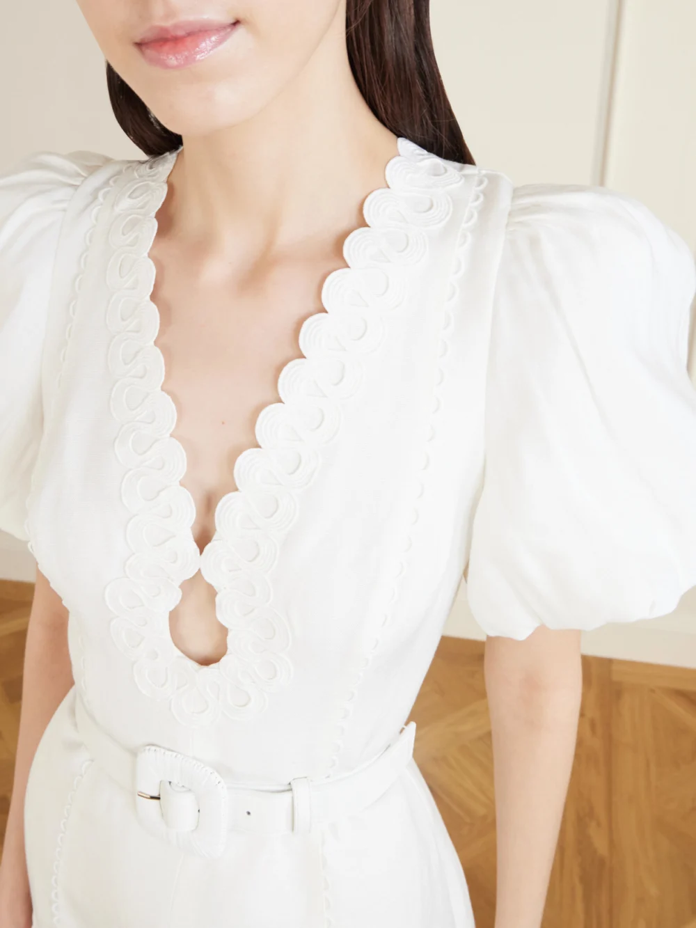 Close-up detail of the Rebecca Vallance Kahlia Ruffled Scalloped Linen-blend Mini Dress