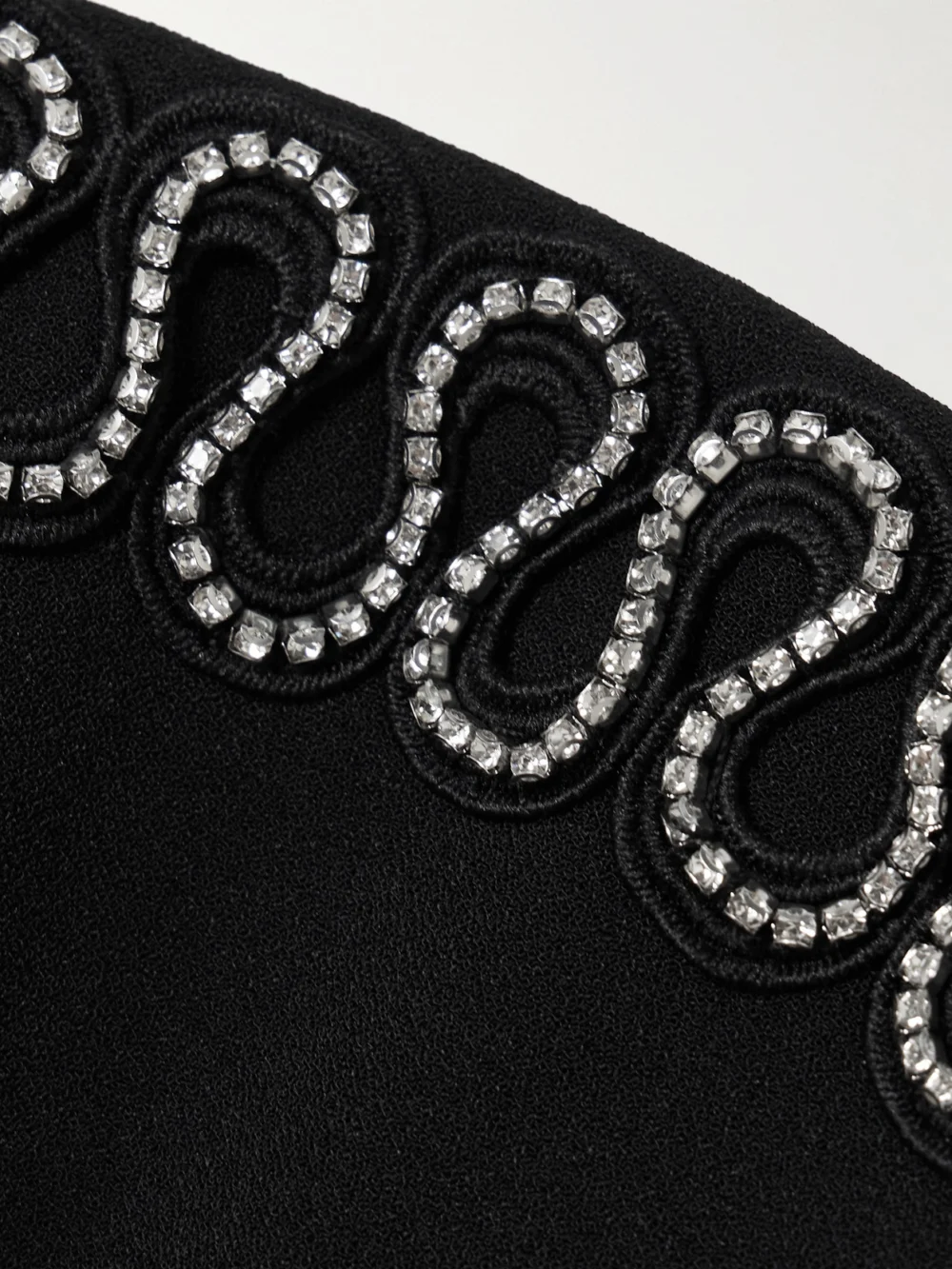 Close-up detail of the Rebecca Vallance Nyx Strapless Crystal-embellished Crepe Mini Dress
