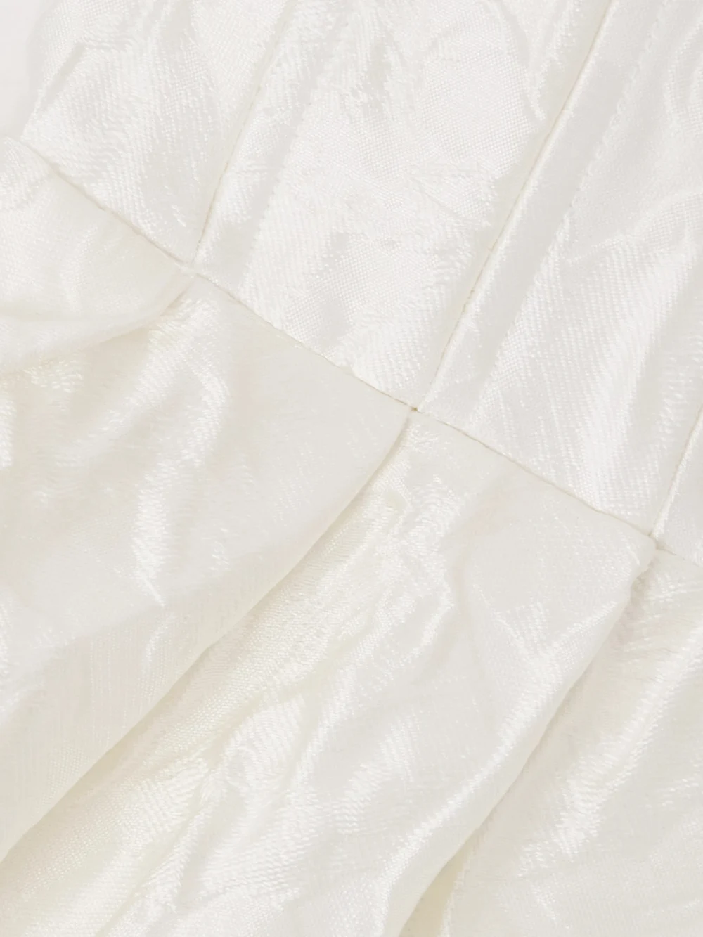 Close-up detail of the Rebecca Vallance Vanilla Dreams Pleated Cloqué Mini Dress