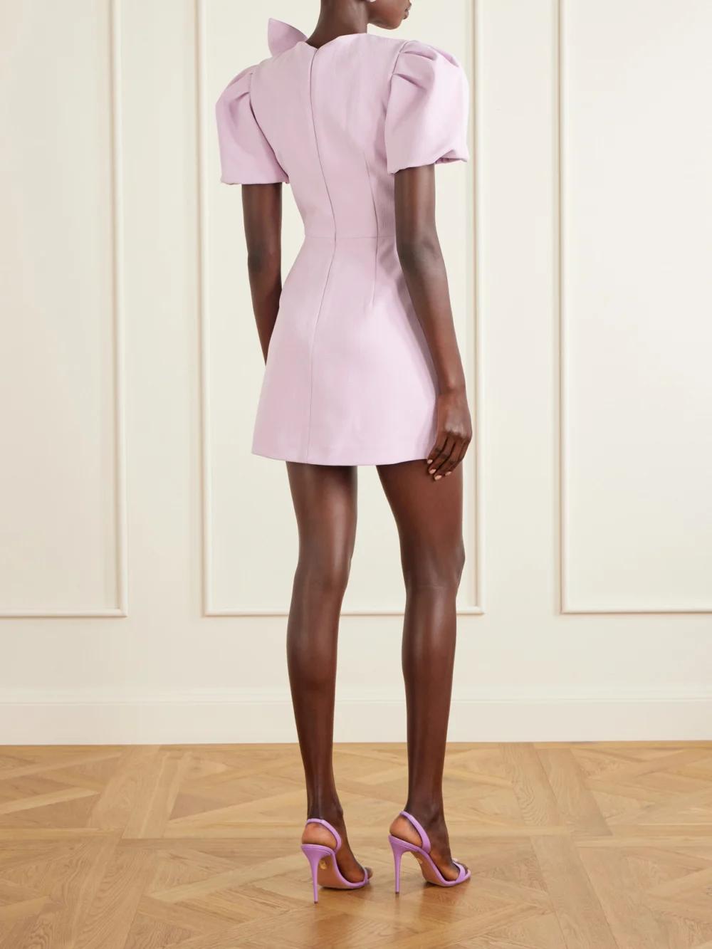Back view of the Rebecca Vallance Yolanda Bow-detail Crepe Mini Dress