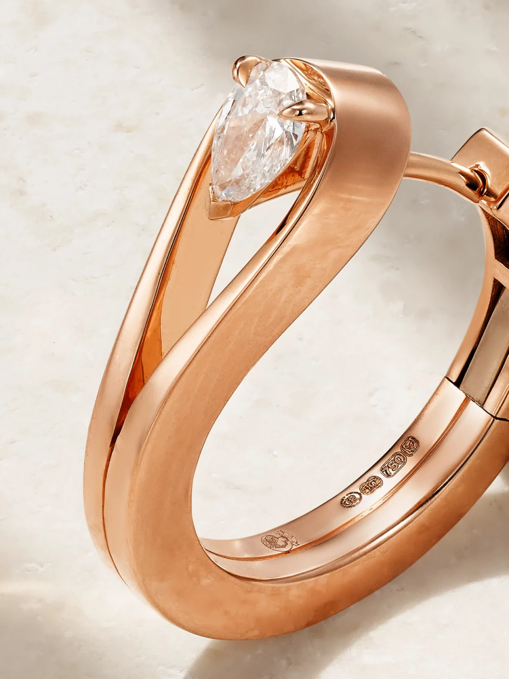 Close-up detail of the Repossi Serti Inversé 18-karat Rose Gold Diamond Earring