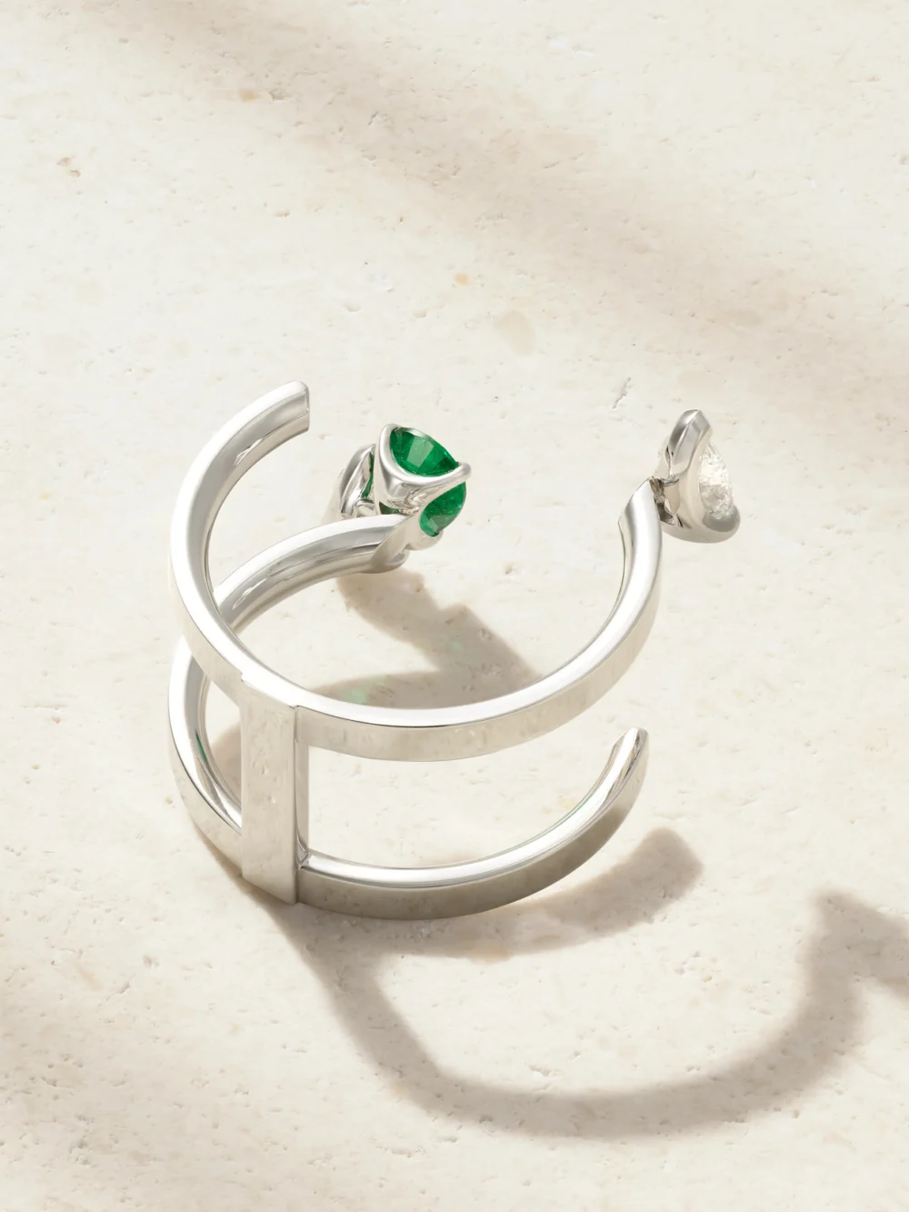 Back view of the Repossi Serti Sur Vide 18-karat White Gold, Diamond and Emerald Ring