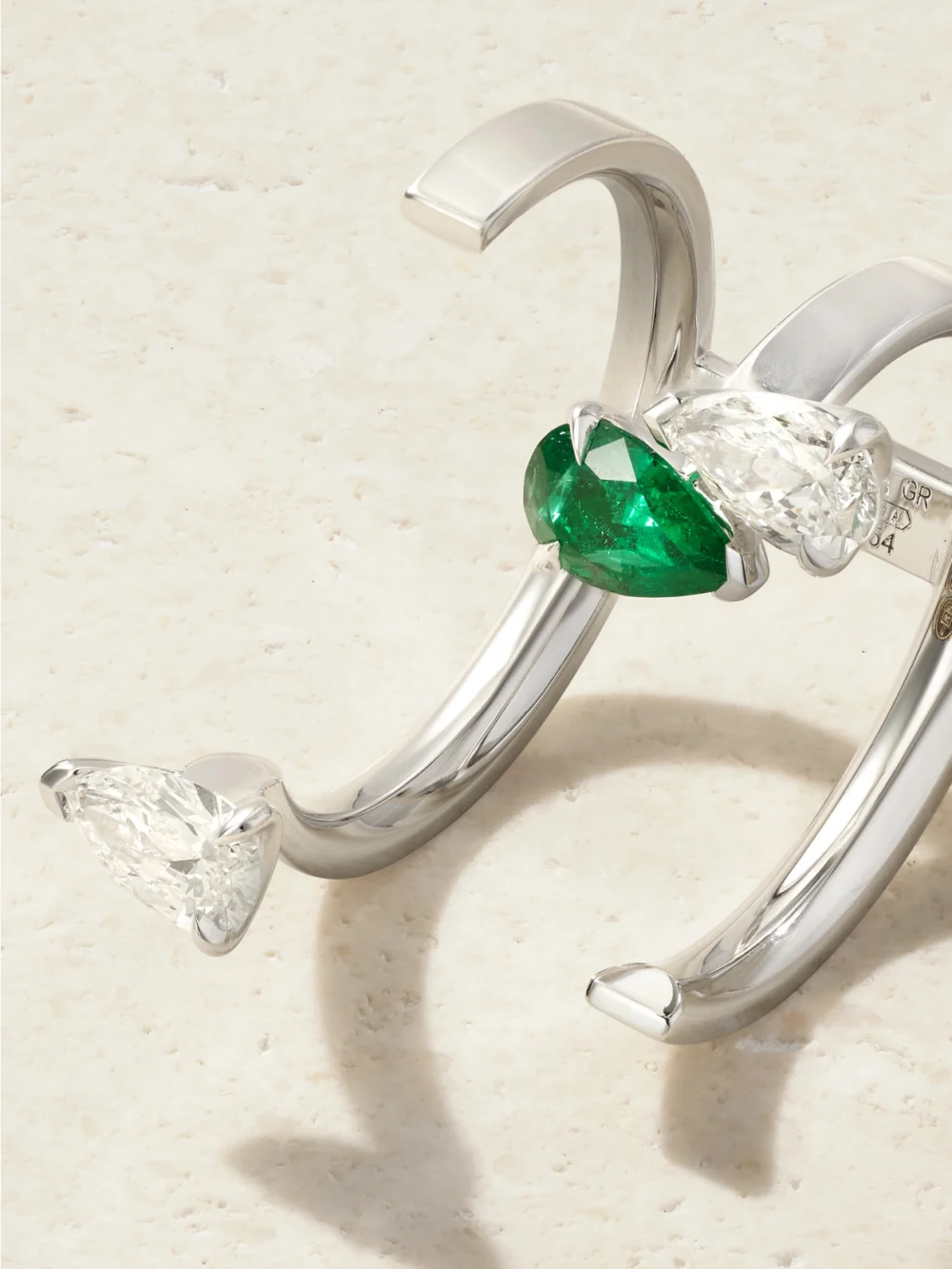 Close-up detail of the Repossi Serti Sur Vide 18-karat White Gold, Diamond and Emerald Ring