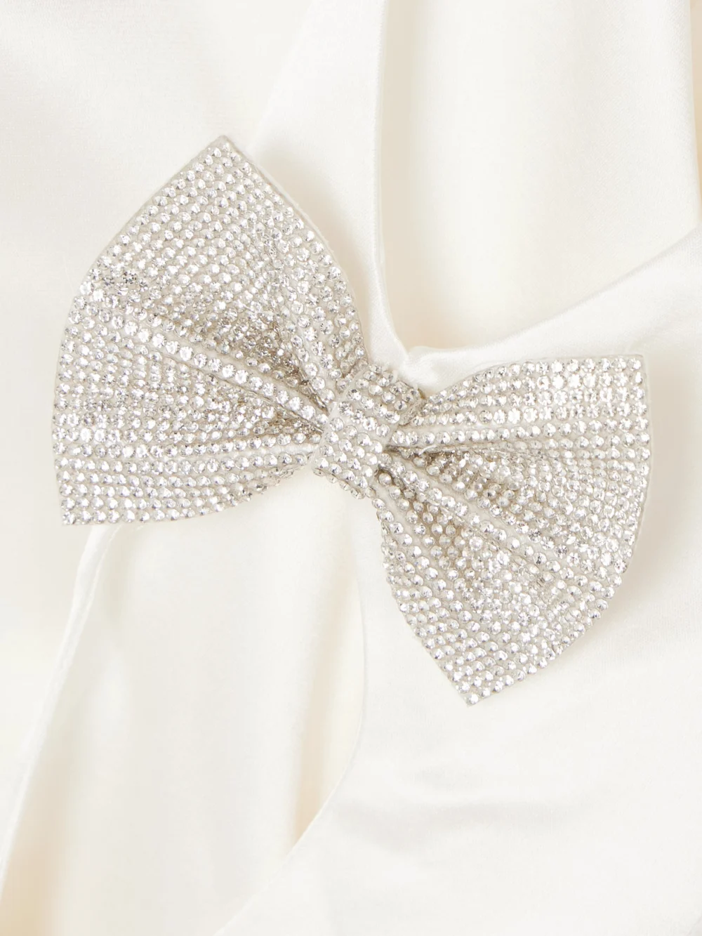 Close-up detail of the Retrofête Nadine Bow and Crystal-embellished Cutout Satin Mini Dress