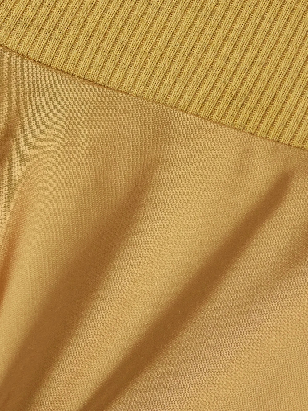 Close-up detail of the Rick Owens Bias Ribbed-knit Trimmed Satin Wide-leg Pants