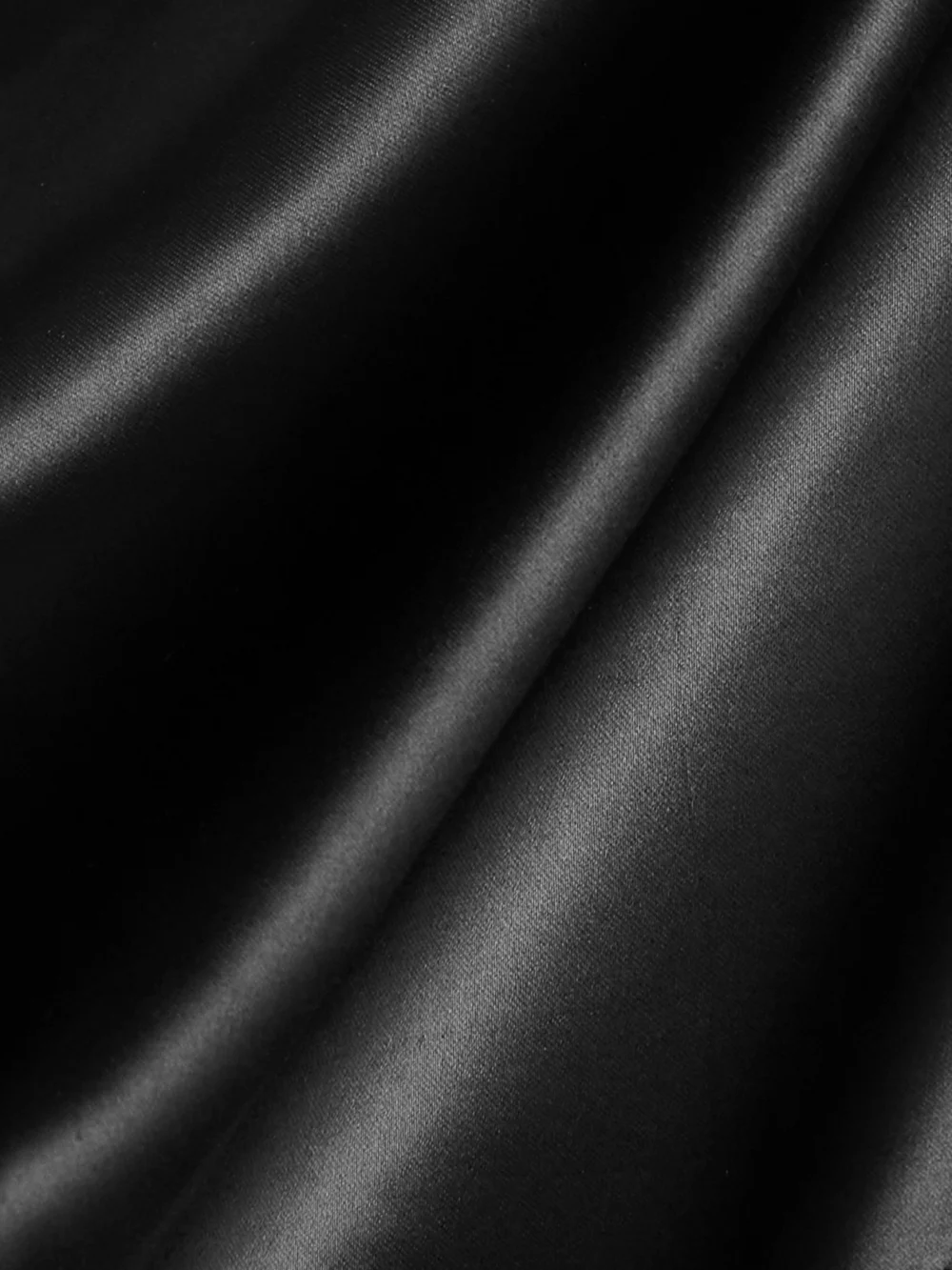 Close-up detail of the Rick Owens Convertible One-sleeve Satin Playsuit