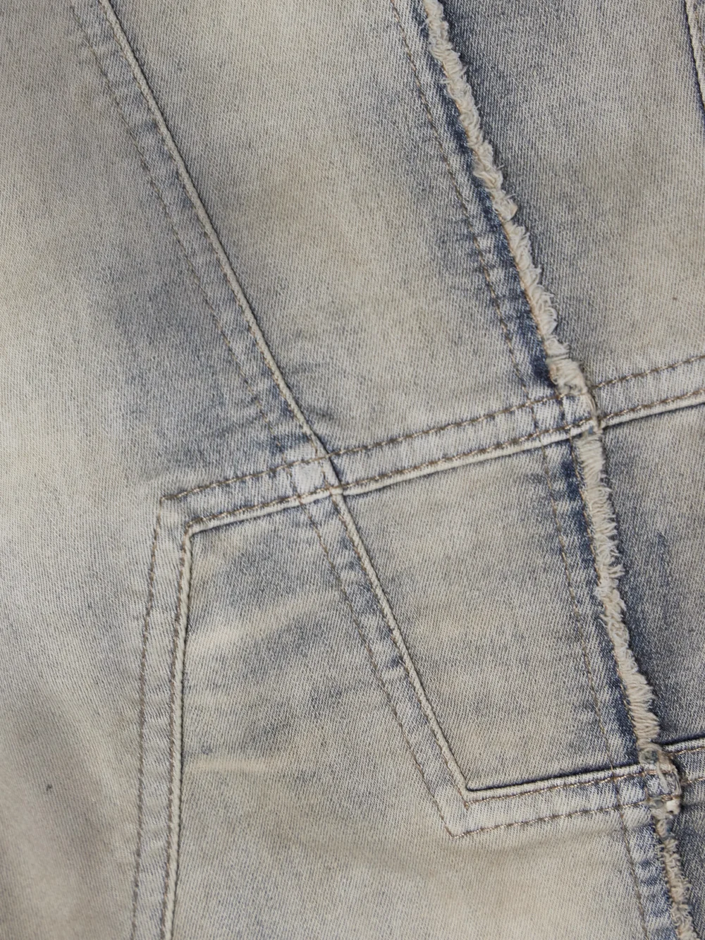 Close-up detail of the Rick Owens Drkshdw Frayed Denim Mini Dress