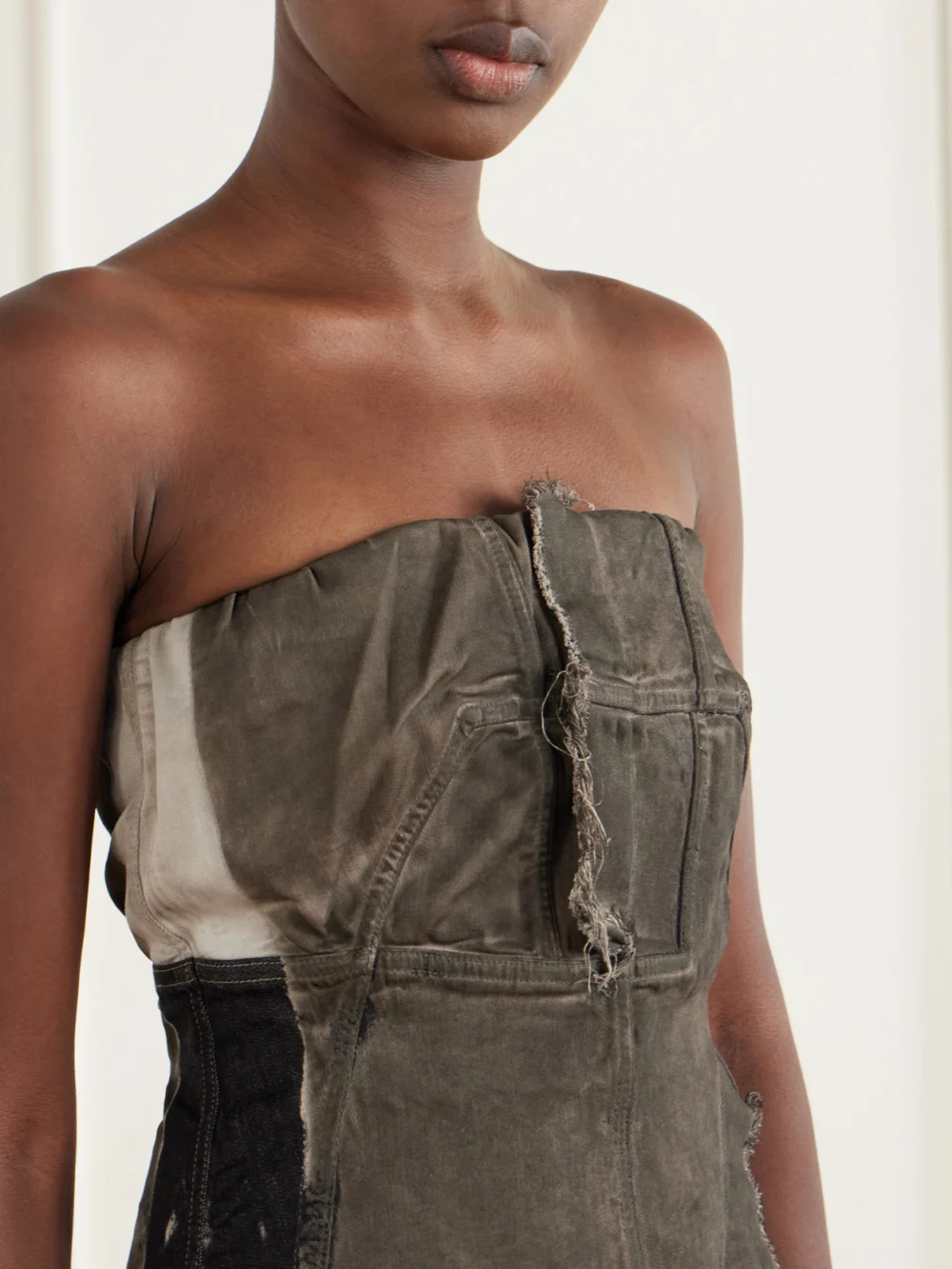Close-up detail of the Rick Owens Drkshdw Paneled Frayed Stretch-denim Top