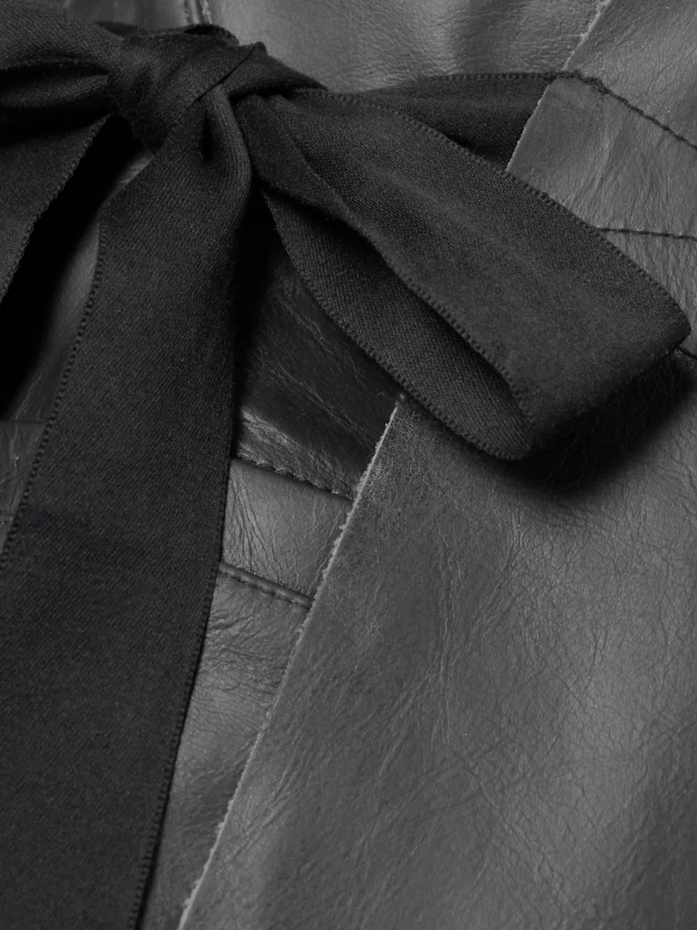 Close-up detail of the Rick Owens Hollywood Grosgrain-trimmed Leather Wrap Jacket
