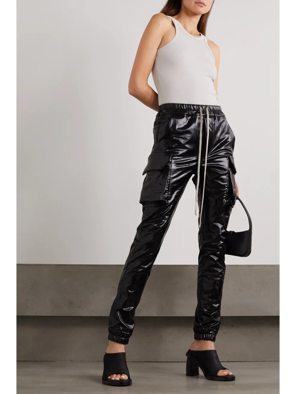 Rick Owens Mastodon Coated Cotton-blend Tapered Cargo Pants, worn by a model