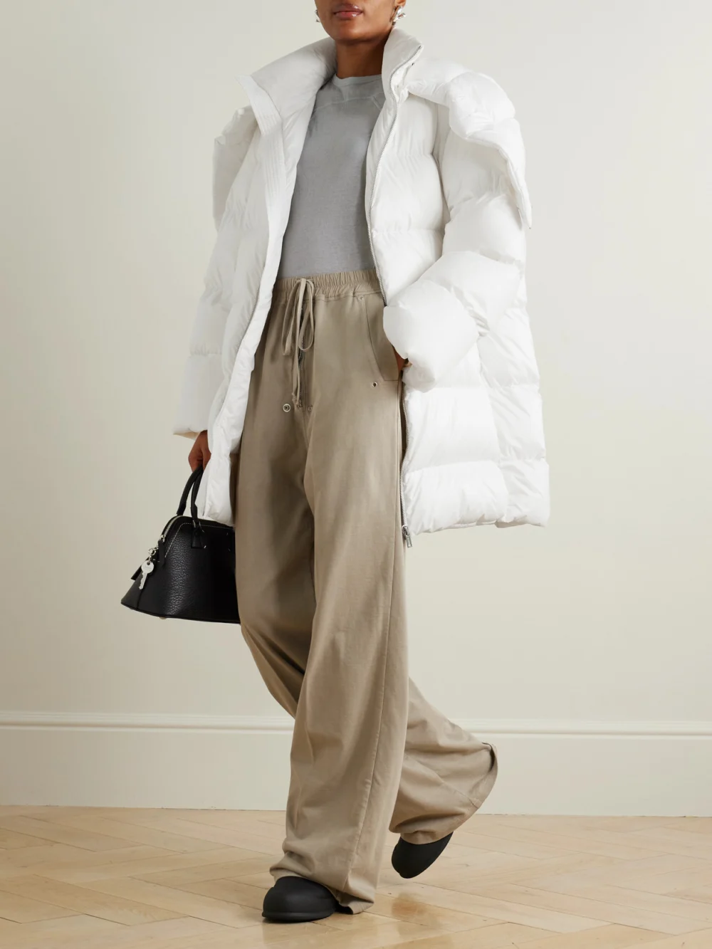 Rick Owens + Moncler Cyclopic Oversized Hooded Appliquéd Quilted Shell Down Jacket, worn by a model