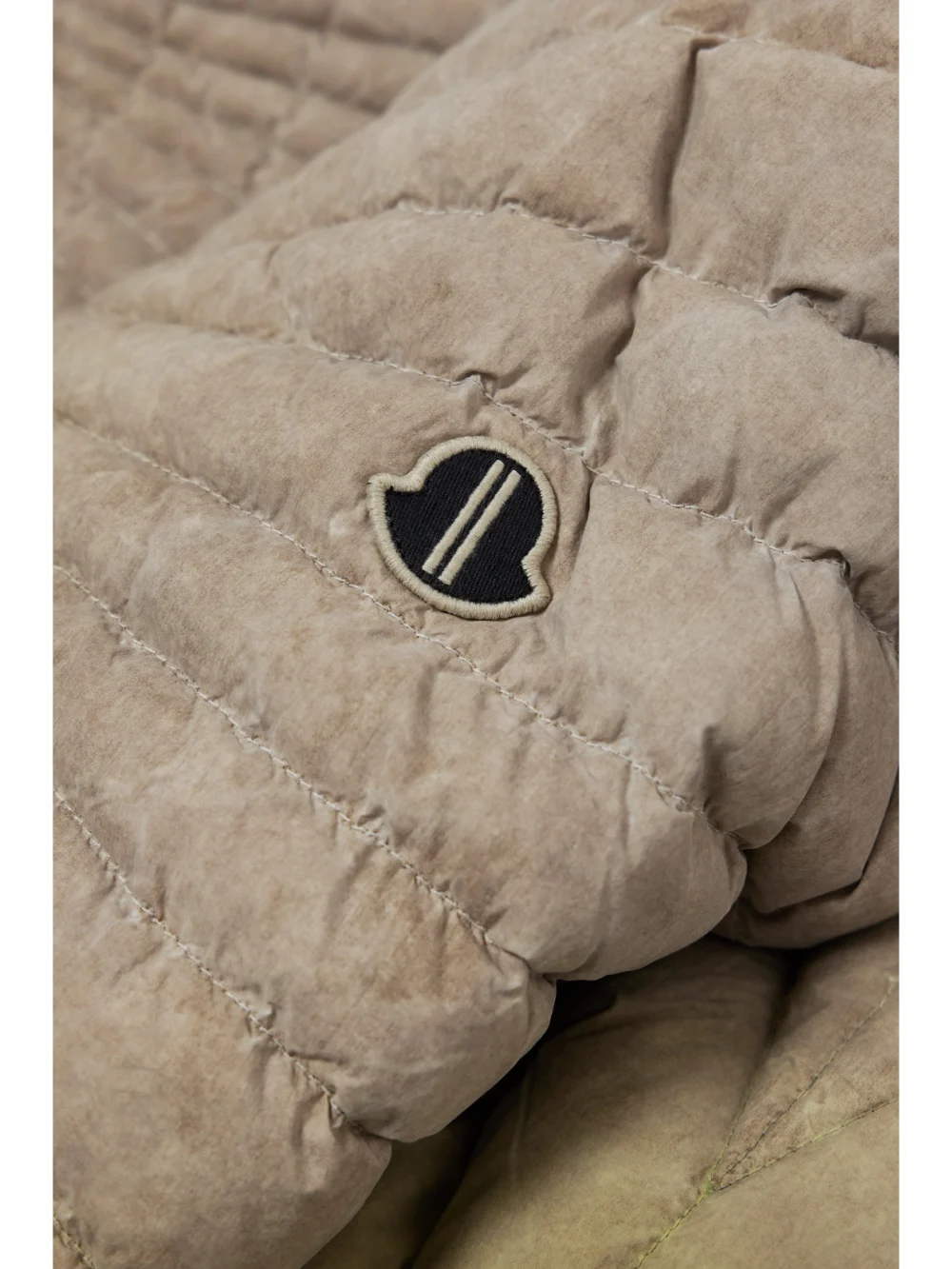 Close-up detail of the Rick Owens Radiance Convertible Quilted Shell Down Jacket