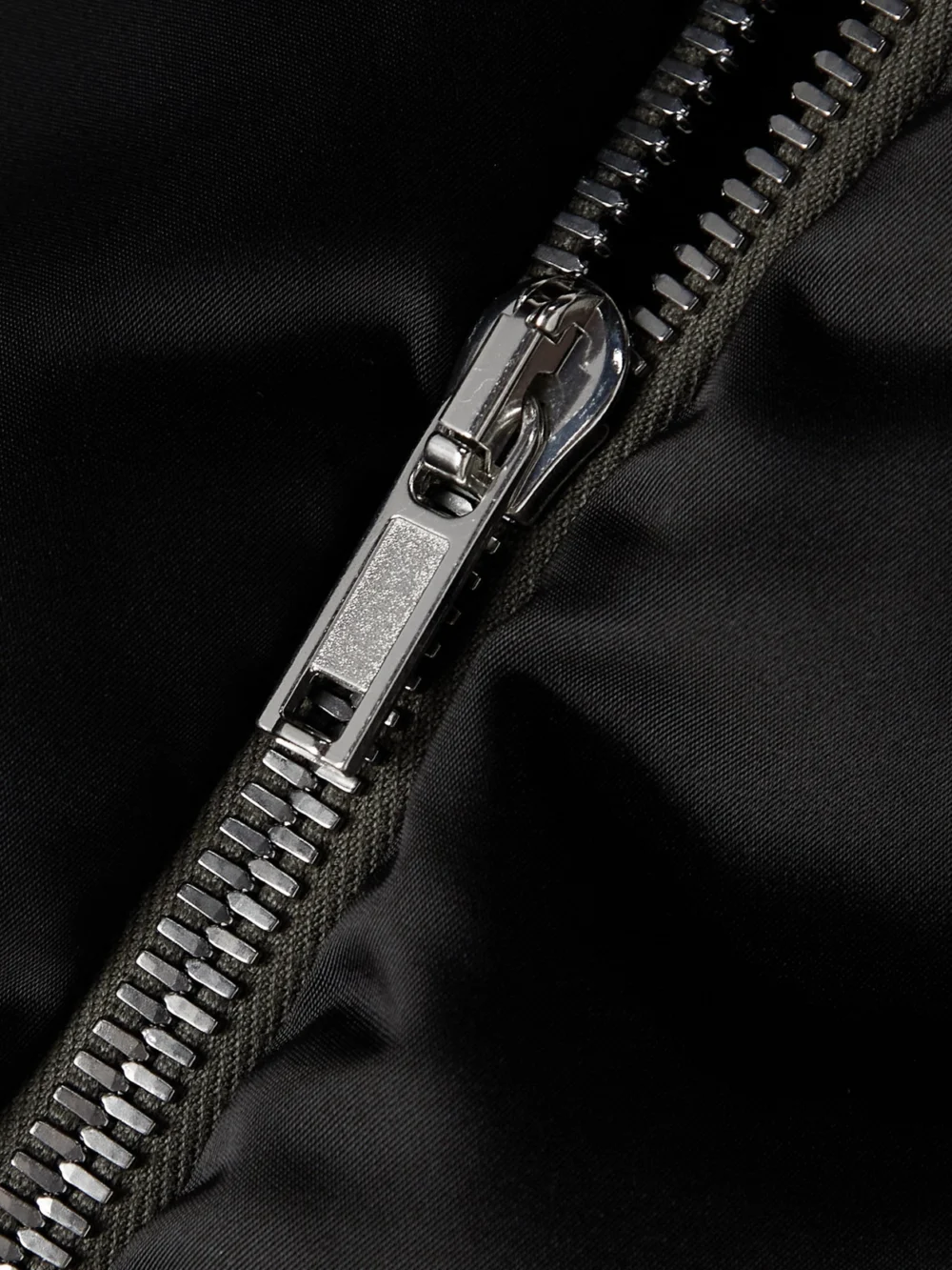 Close-up detail of the Rick Owens Tie-detailed Wool-trimmed Quilted Shell Down Bomber Jacket