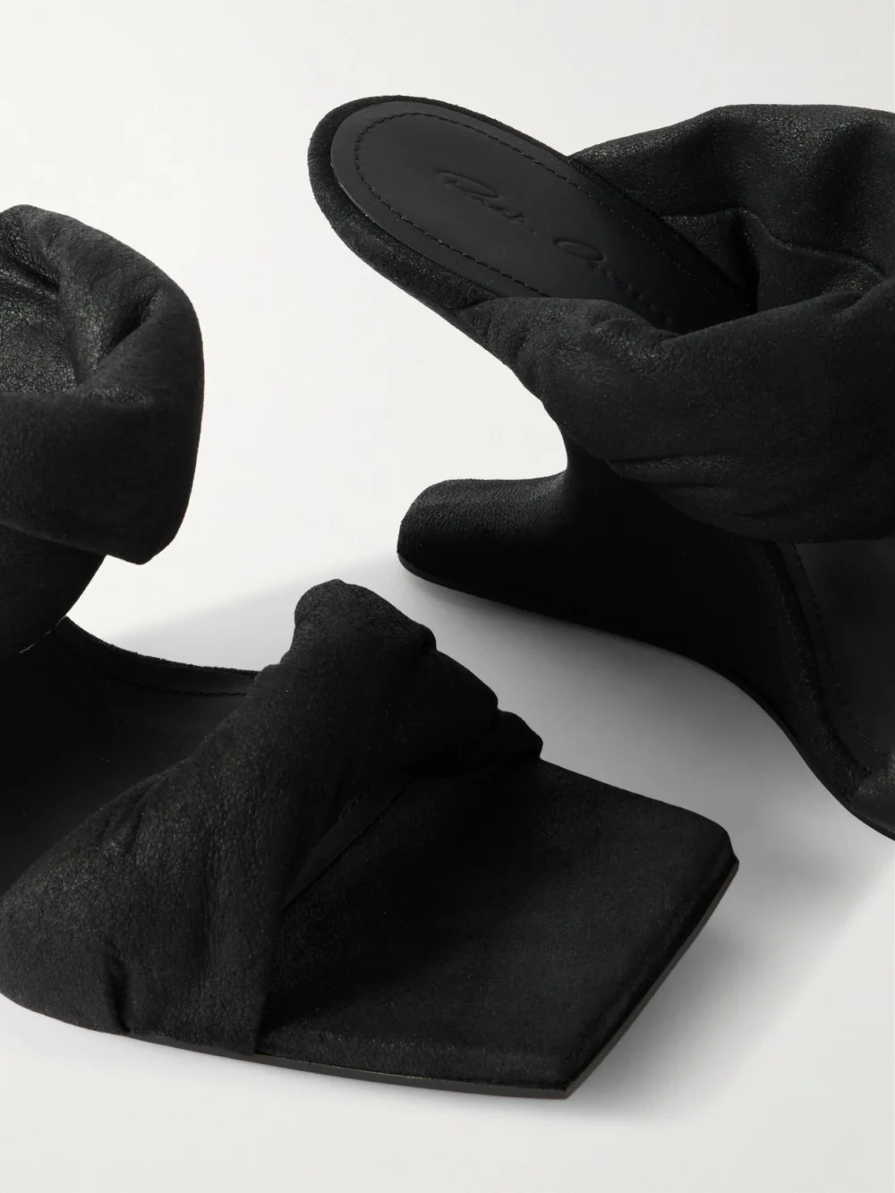 Close-up detail of the Rick Owens Twisted Cantilever Suede Wedge Mules