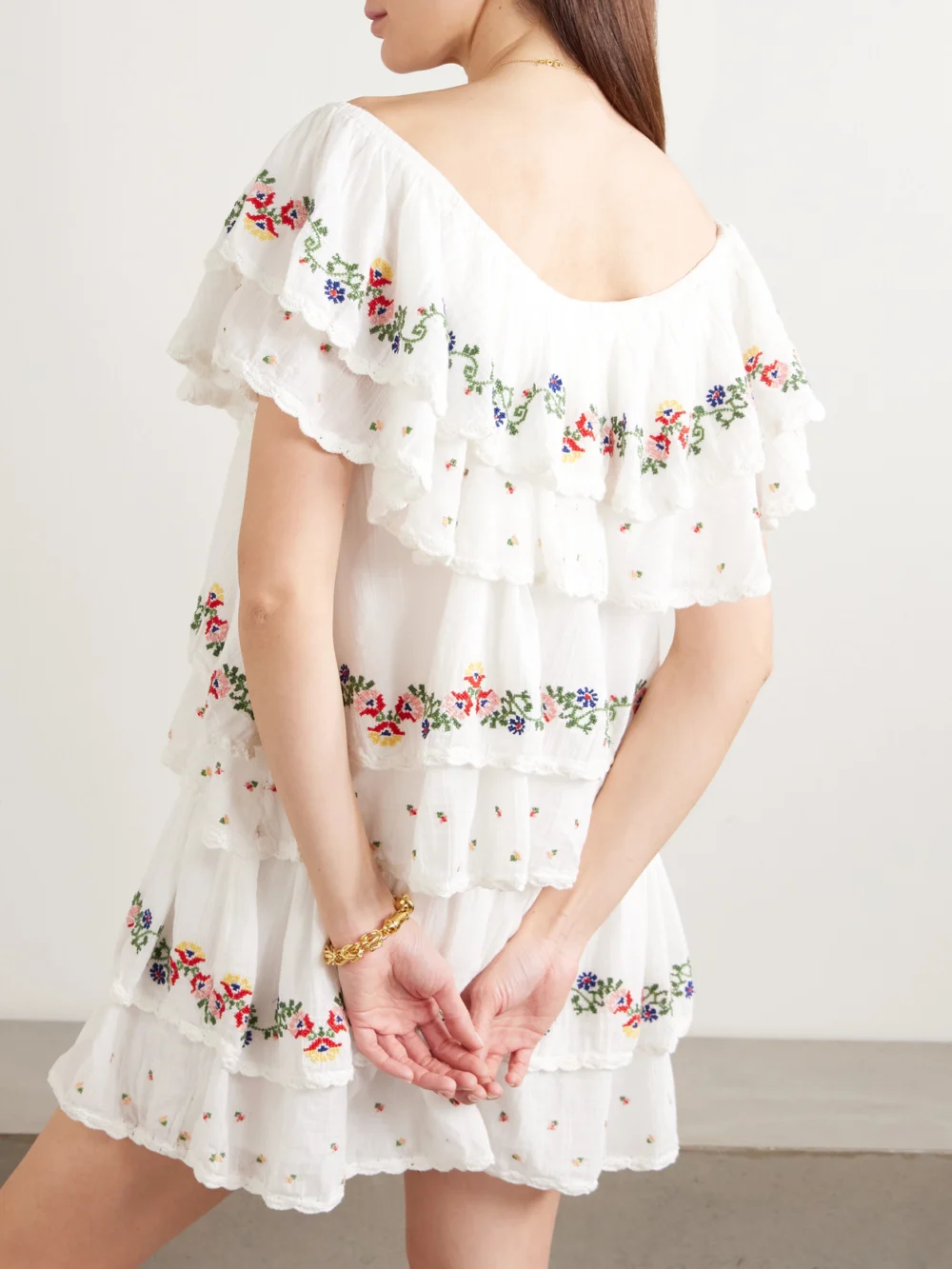 Back view of the Rixo Leilani Tiered Embroidered Cotton-voile Mini Dress